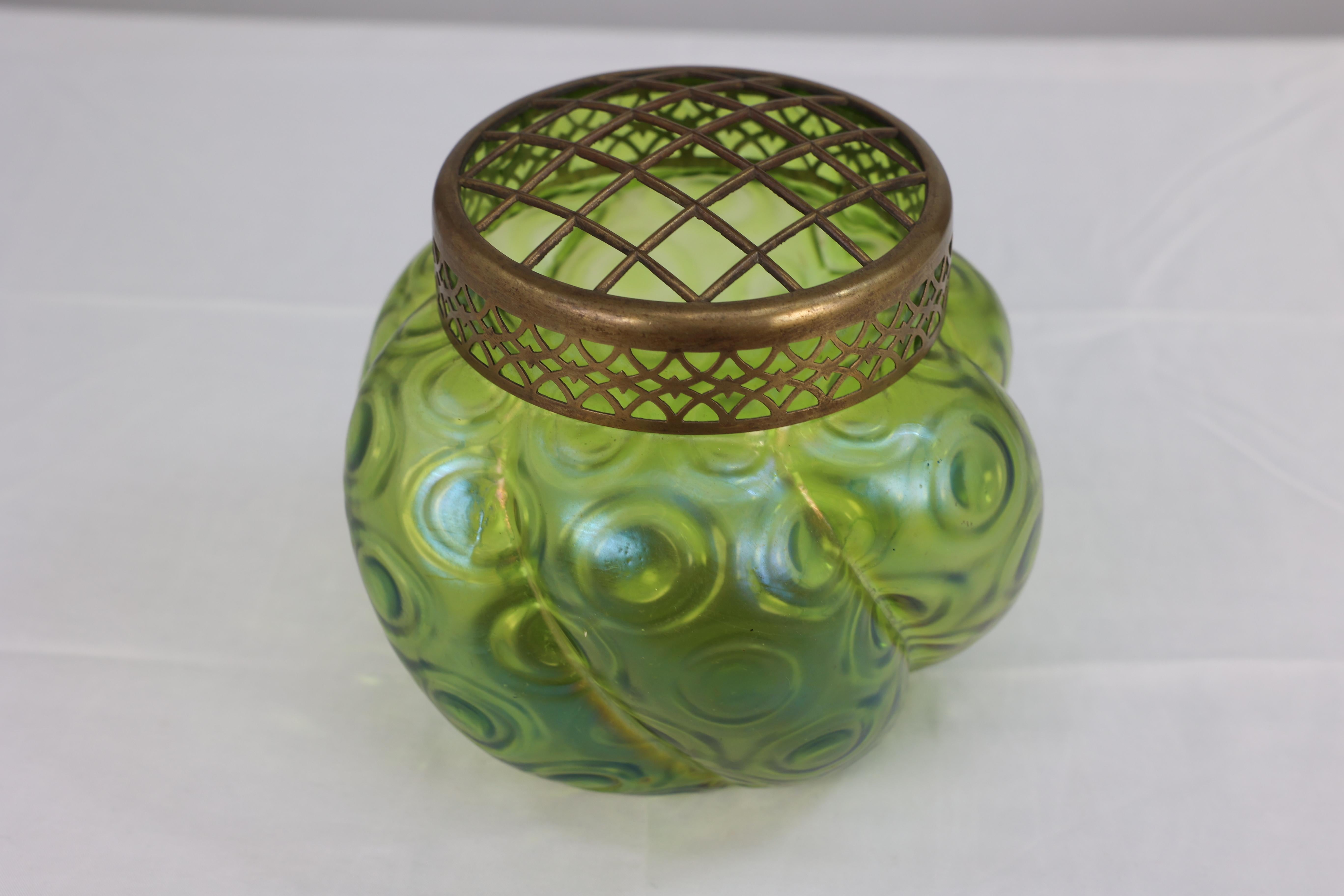 Hand-Crafted Loetz (attributed). A green swirl glass flower holder with decorative brass top For Sale