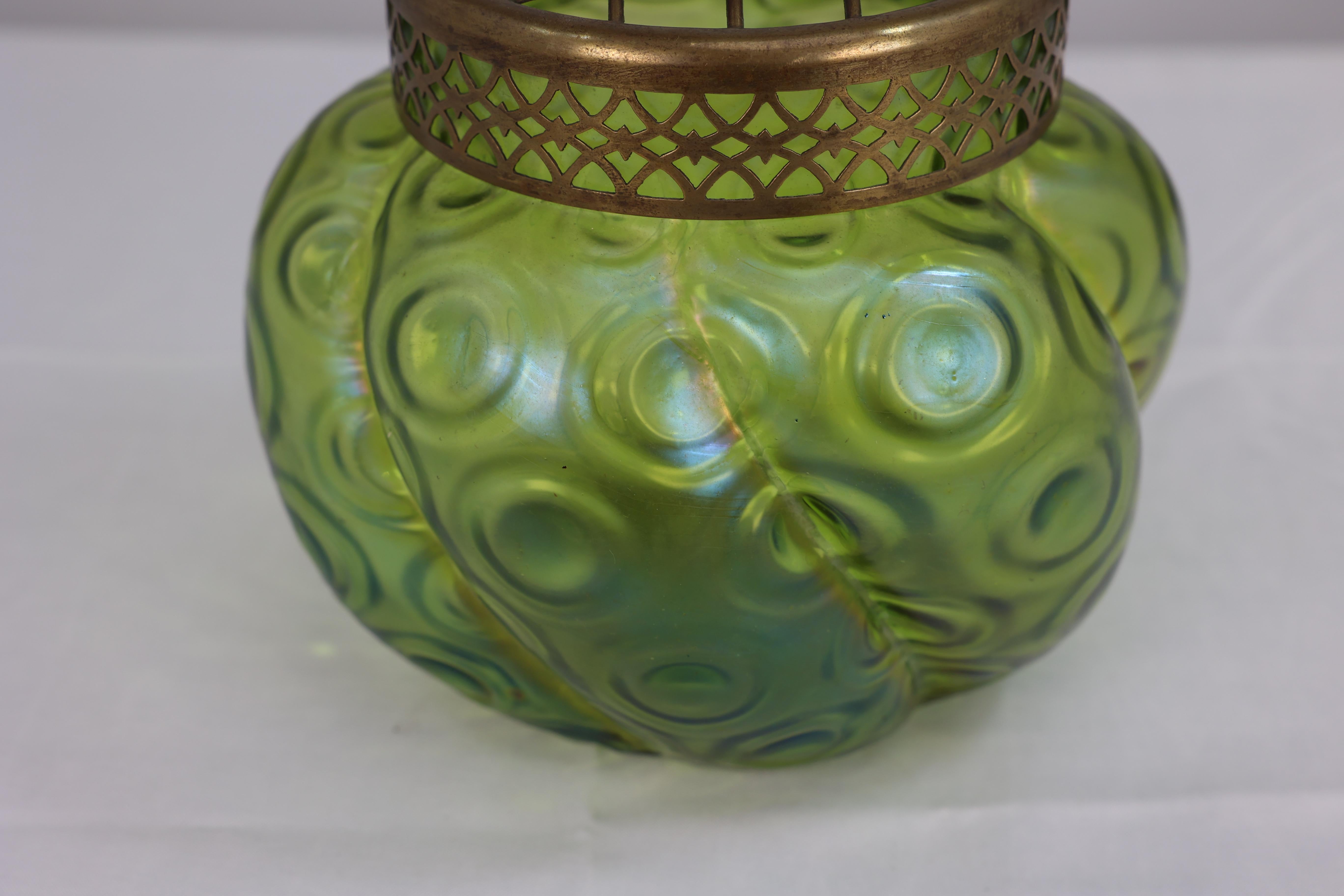 Glass Loetz (attributed). A green swirl glass flower holder with decorative brass top