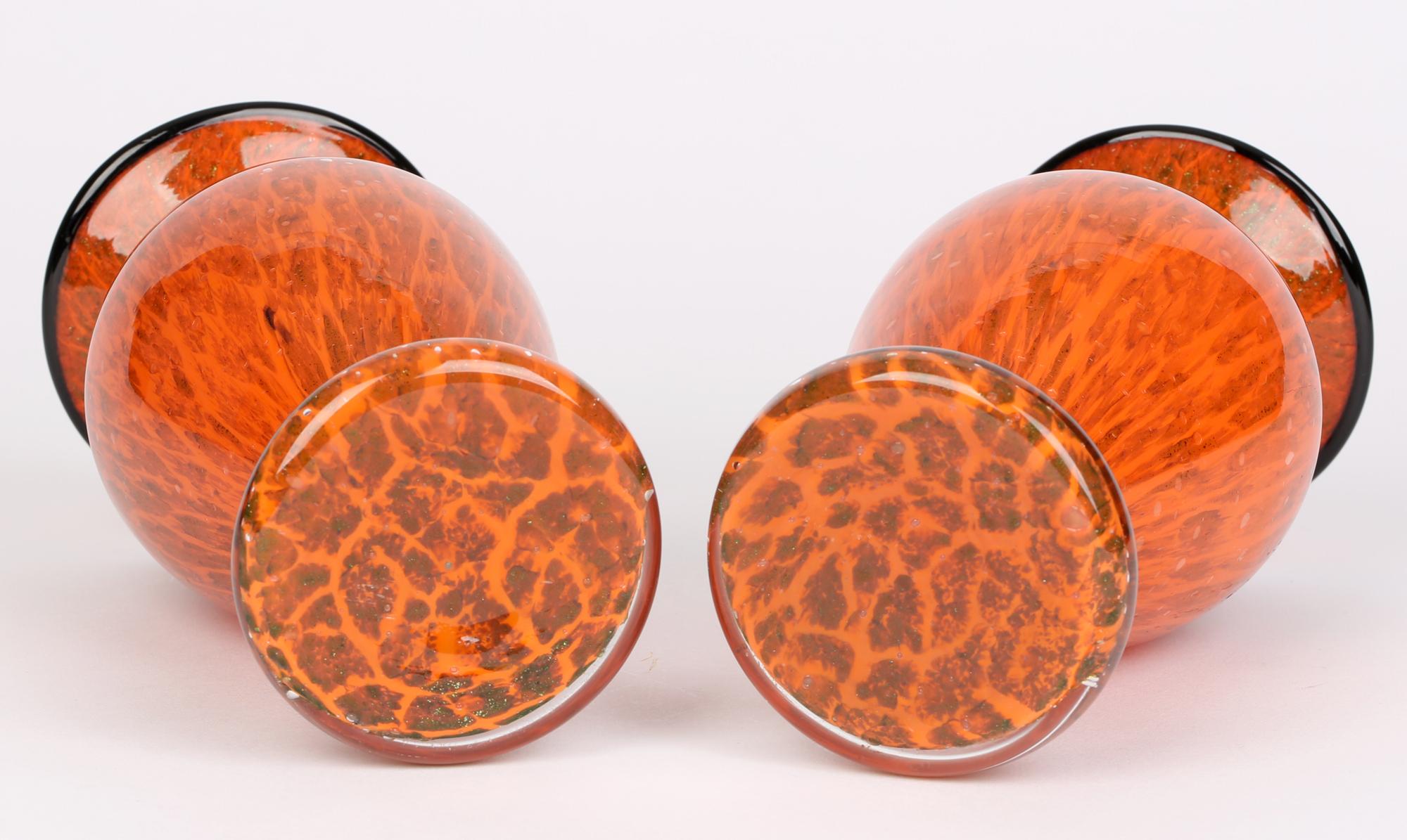 Fine pair Bohemian art glass tango vases with gold aventurine inclusions attributed to Loetz and dating from the 1920’s. These stylish vases are blown in clear glass with a cased orange glass body with patchwork aventurine inclusions and with a