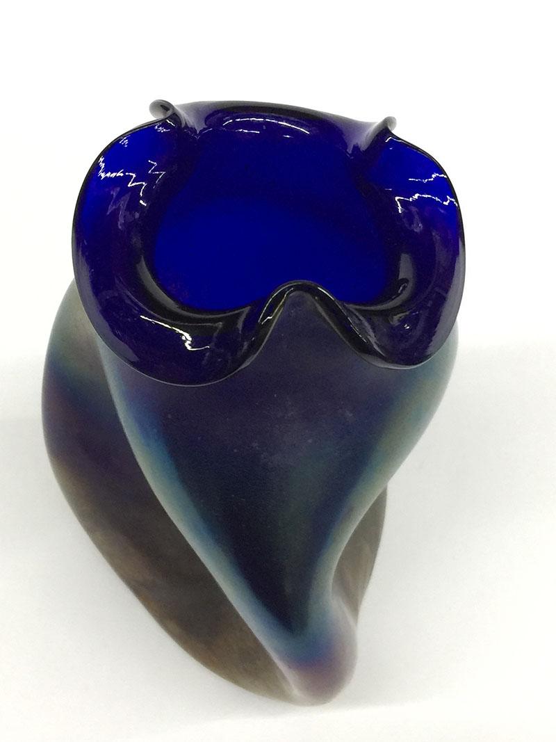 A Bohemian vase, Silberiris decor, Cobalt Iridescent Vase, circa 1900

Cobalt iridescent vase, with wavy opening, circa 1900.
Silberiris decor, Candia, cobalt ground. 
Thickly applied silvery yellow powder renders the glass opaque and gives it a