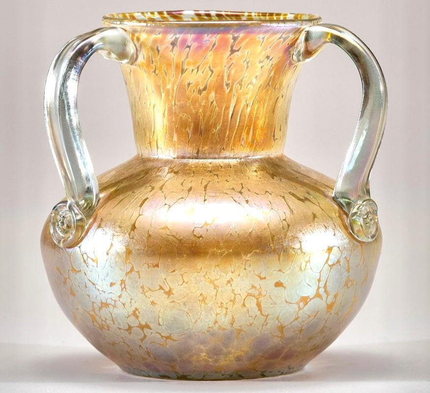 Loetz Candia Papillos three handled vase. 
Austria
Circa 1910
Measures: Height: 5.75 inches 
Diameter: 5.5 inches
Condition Excellent with no issues.

AVANTIQUES is dedicated to providing an exclusive curated collection of Fine Arts,