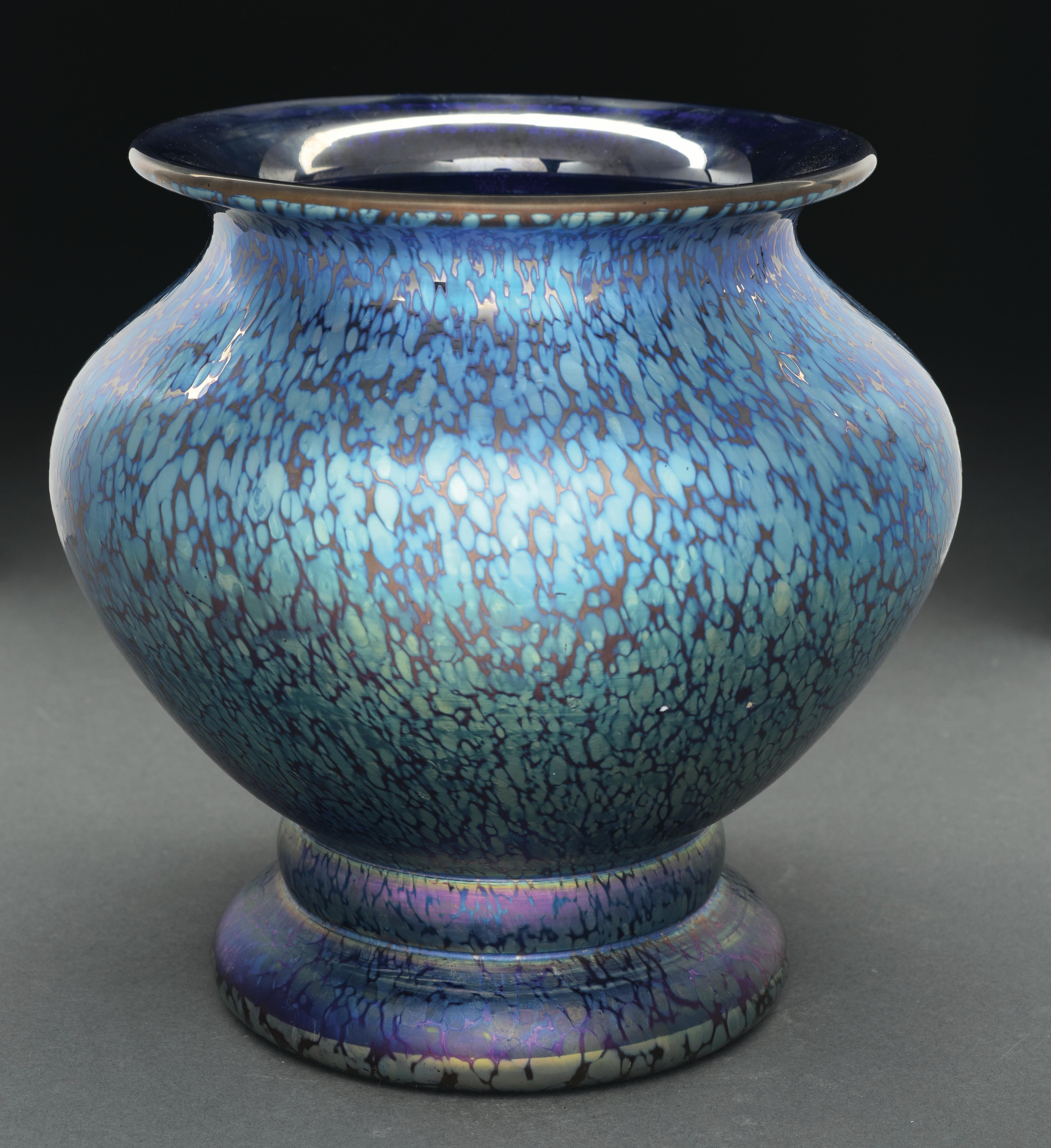 This Loetz vase in the Cobalt Papillon pattern has blue iridescent Papillon design covering the exterior of the vase. 

Vase is signed on the polished pontil 