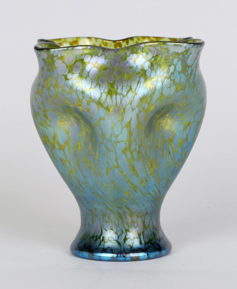 Stylish Bohemian Crete Papillon iridescent glass vase with pinched designs to the body and neck by Johann Loetz Witwe and dating from around 1898. The goblet shaped rounded vase has a wonderful blue iridescence on a green glass ground with four