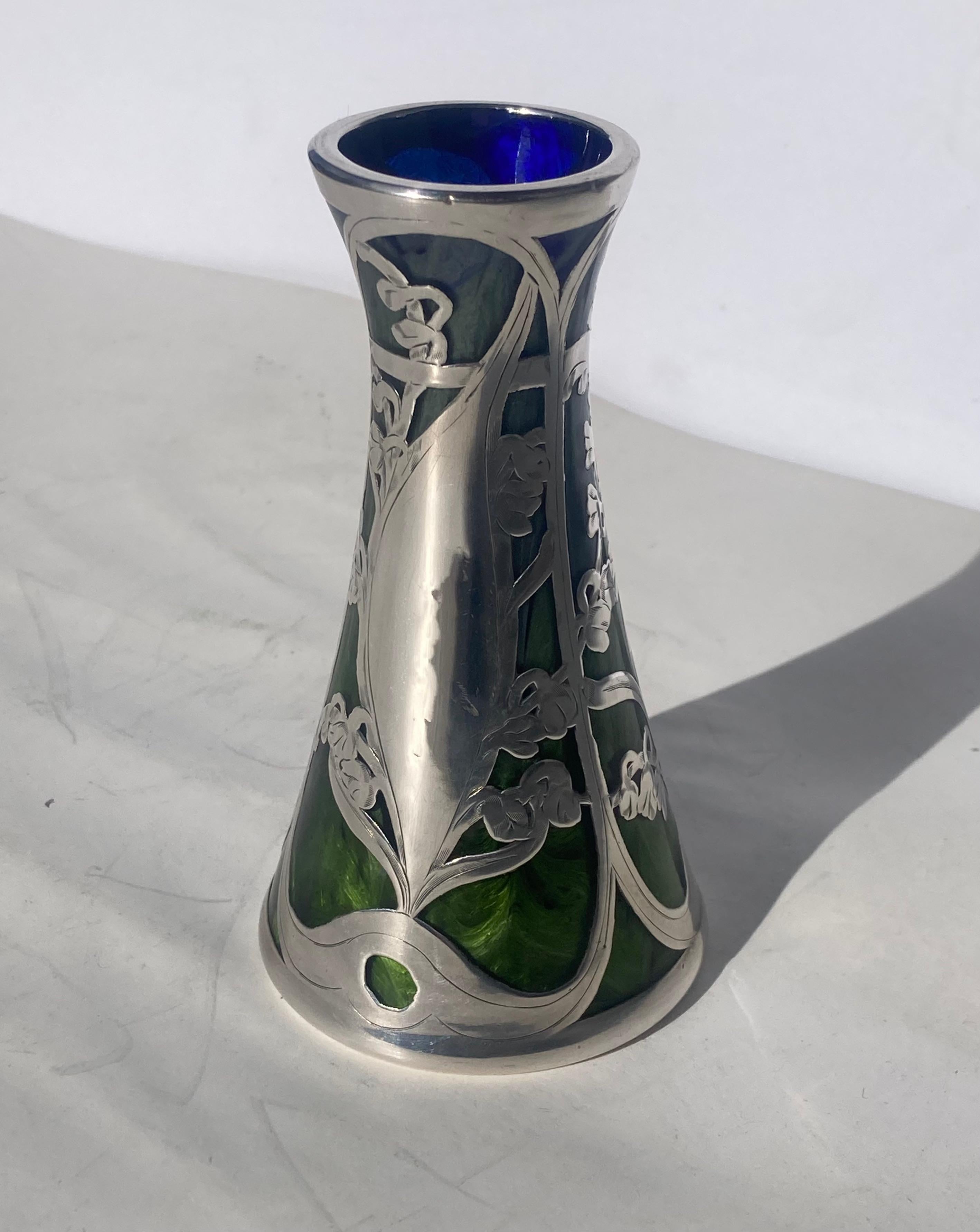Beautiful vase in swirl Titania glass and overlay silver, This is a rare antique vase.