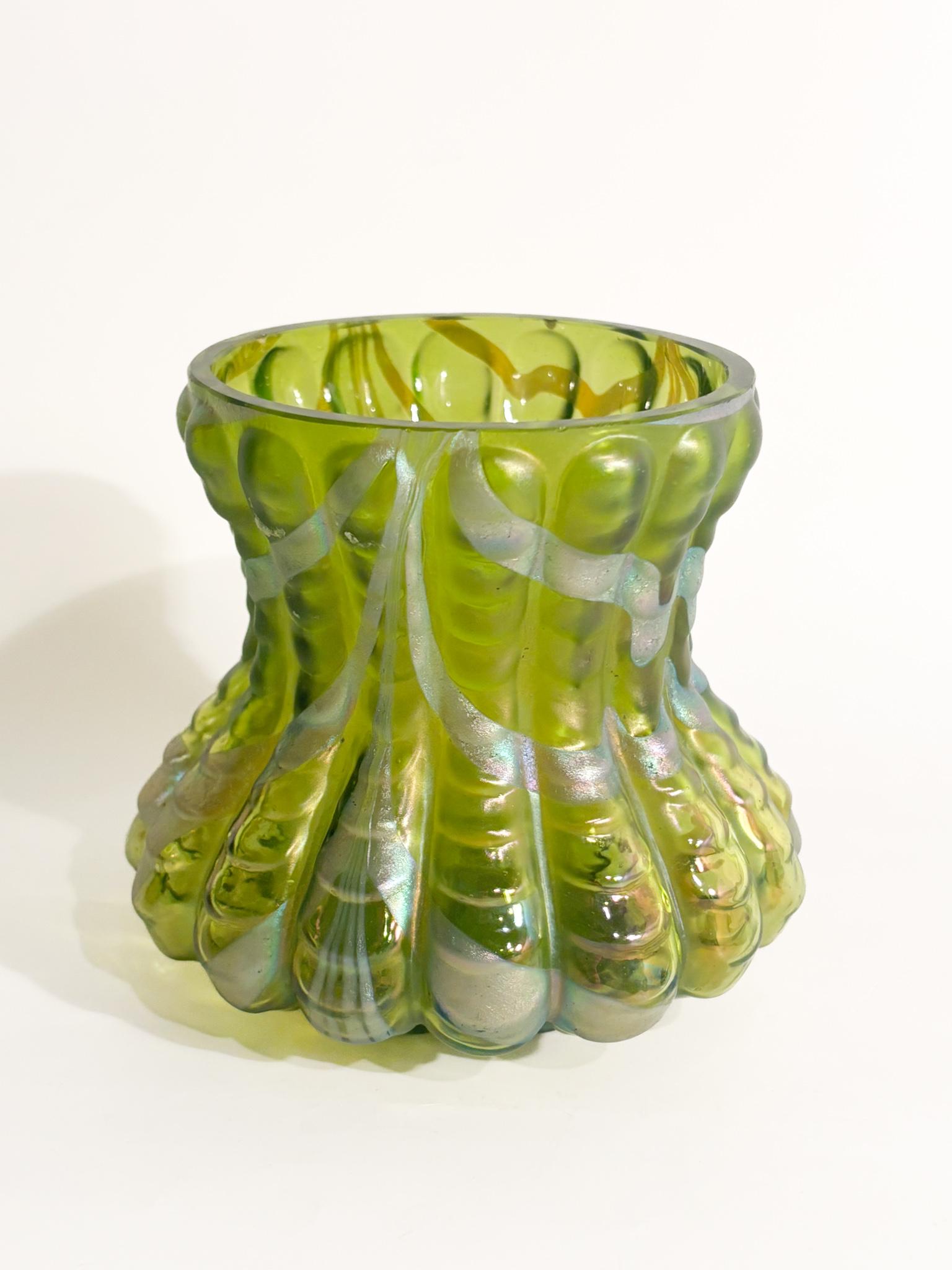Iridescent green and silver crystal vase by Loetz, made in the 1950s.

Ø cm 11 h cm 10

Loetz is a name that immediately evokes images of extraordinarily beautiful and refined blown glass. This Austrian glassworks, founded in 1839, produced some of