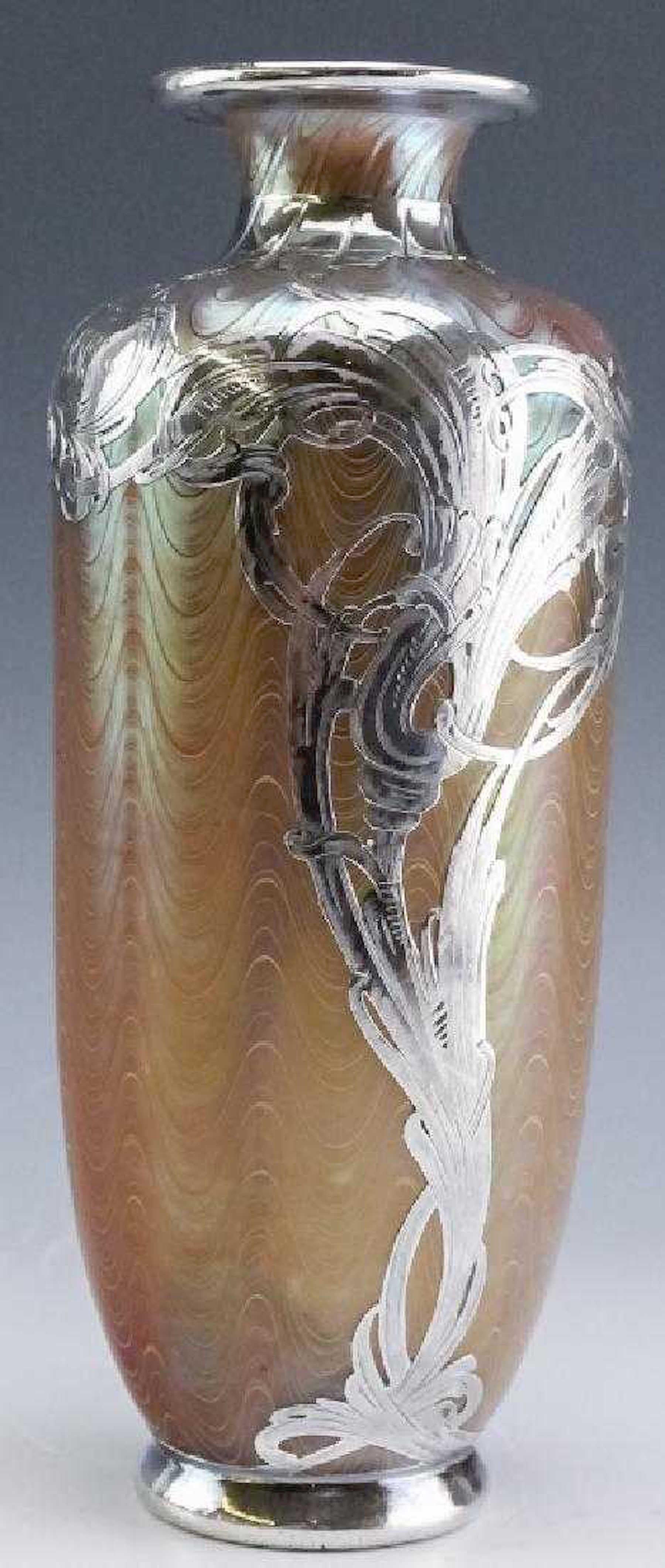 Loetz Phänomen silver overlay vase, engraved Loetz Austria
A large iridescent glass vase with undulating lines with silver applique.

 
