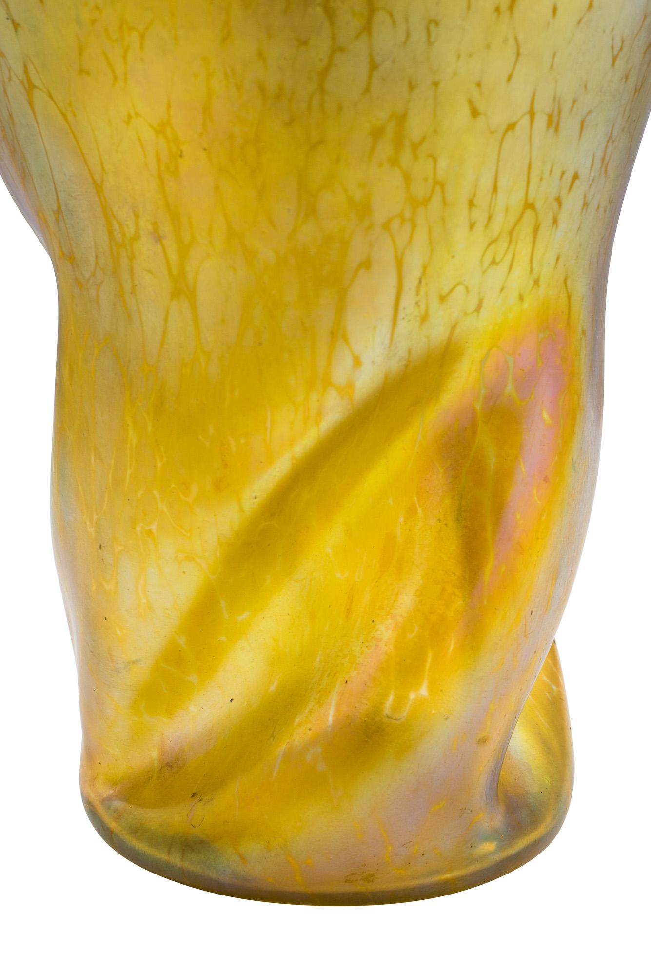 The Papillon decoration was one of the most successful variants by Loetz, circa 1900. Ranging among the less expensive pieces from that time it was produced in many colors and on complex designs. The twisted form of this vase is empowering the