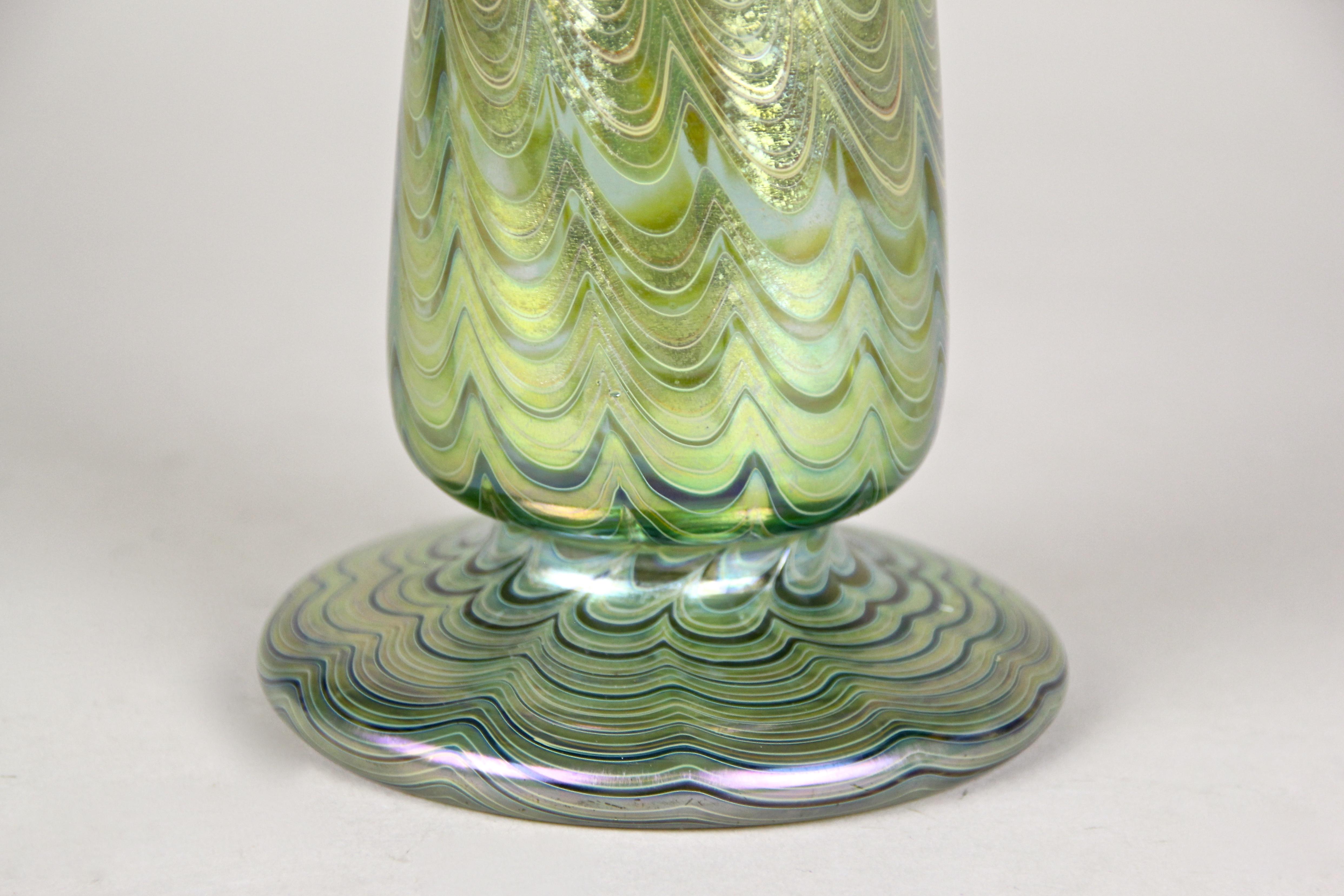 Fantastic Loetz Witwe glass vase out of the famous workshops in Klostermuehle/ Bohemia, circa 1899. The beautifully shaped glass vase was artfully processed in the breathtaking decor Phaenomen green genre 6893 and impresses with its blue or green or