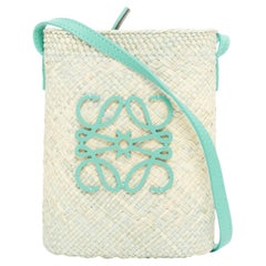 LOEWE 2023 Paula's Ibiza Melange Iraca Palm anagram woven crossbody bucket bag