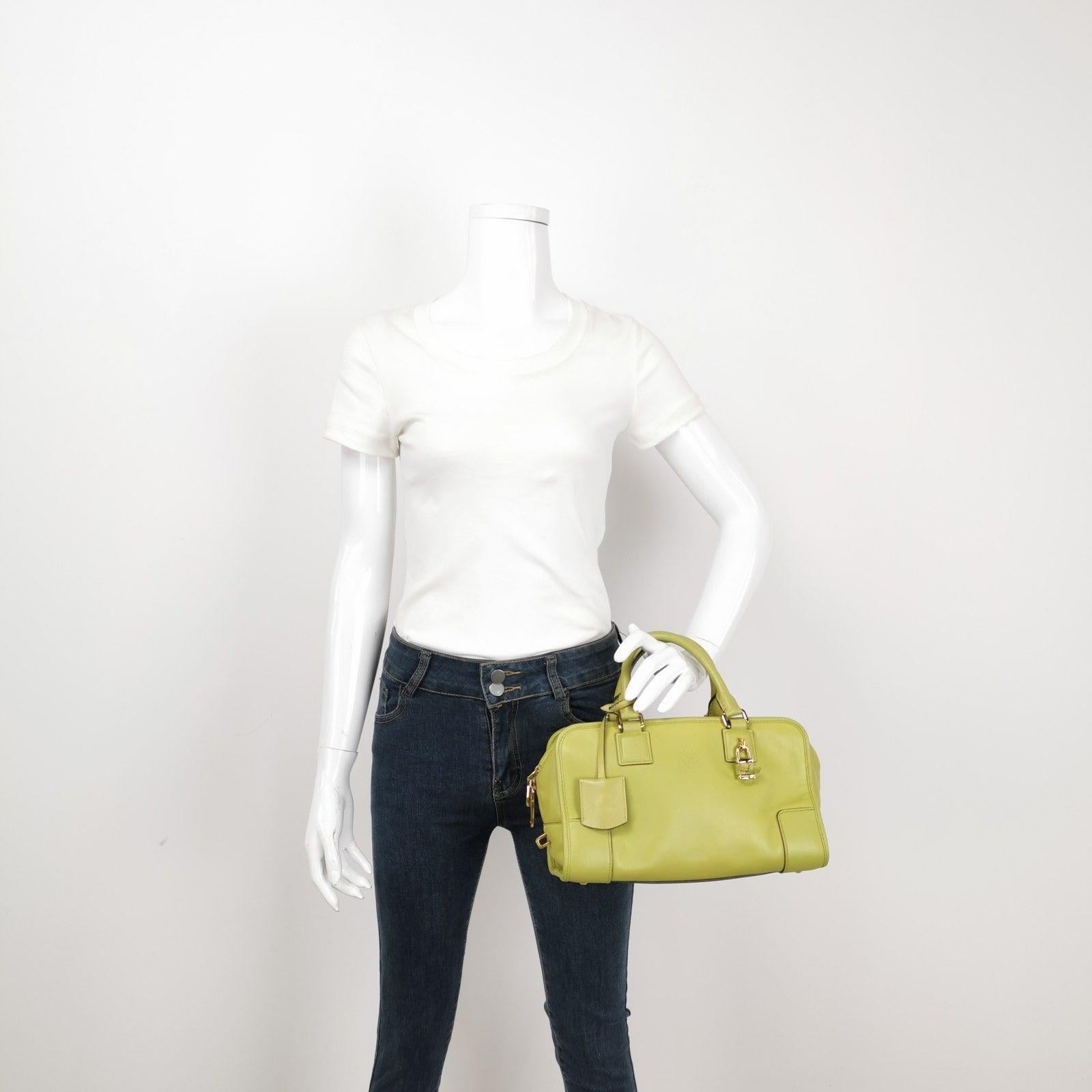 Loewe Amazona 29 in Olive Green Lambskin Leather These are professional photos of the actual bag offered by Luxbags. Top handle bag in boxy trunk style is back in fashion in 2024 thanks to shows by Prada and Miumiu. The Loewe Amazona bag is a