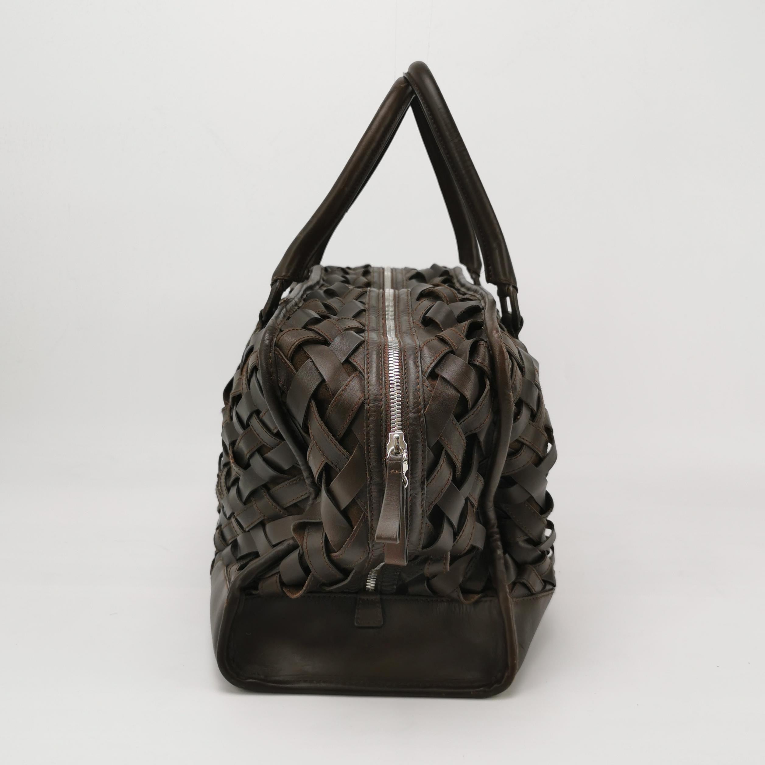 Loewe Amazona 44 in Brown Intrecciato Woven Calfskin Leather Travel Bag
These are professional photos of the actual bag.
The Loewe Amazona bag is a stylish and functional option for everyday use, with a structured yet soft shape. Originally designer