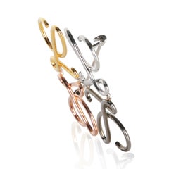 Loewe Anagram-Brosche