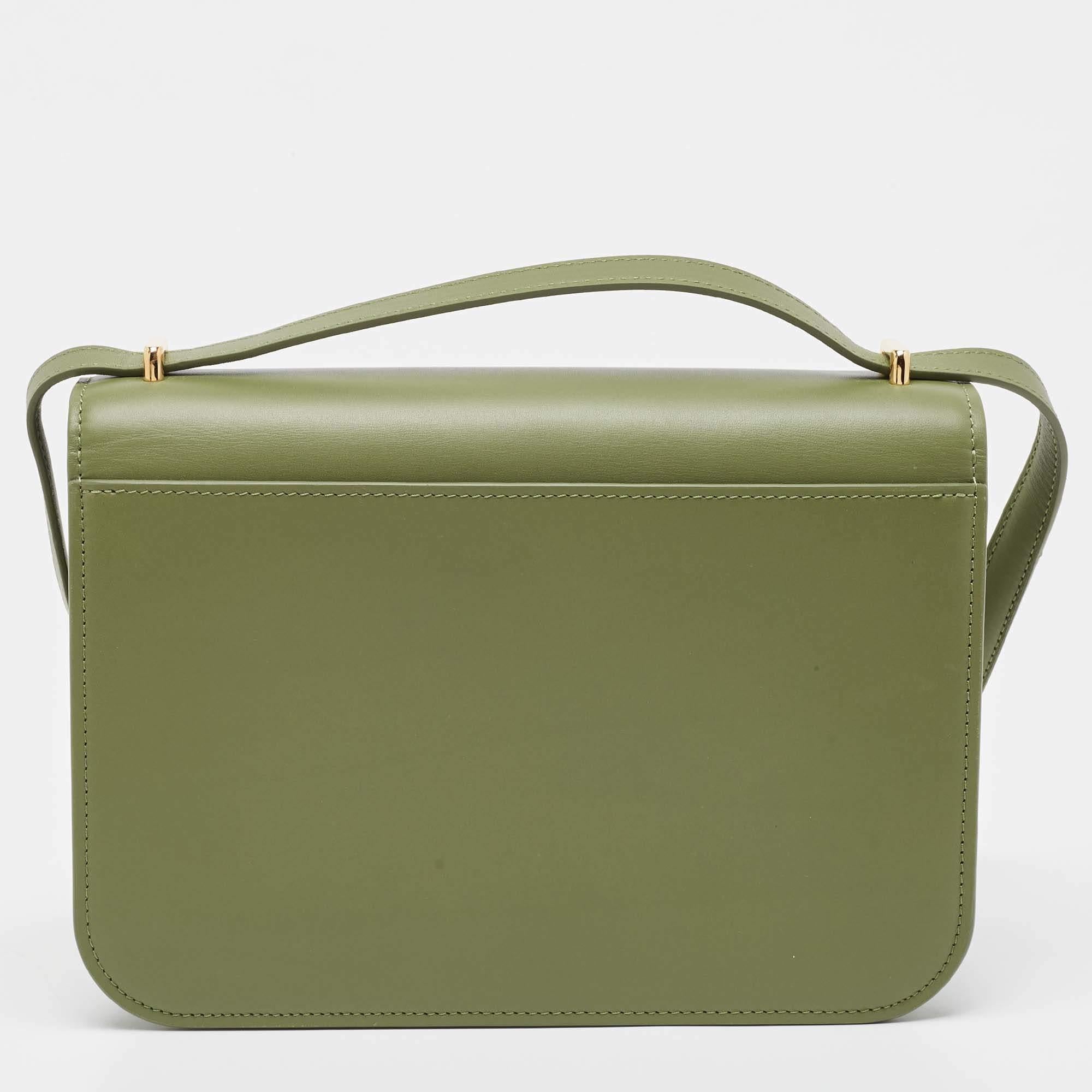 Structured, sophisticated, and stylish are some words that describe this shoulder bag! Crafted from the best quality material, the creation is adorned with the label's signature appeal and equipped with a well-spaced interior. Carry it to parties or
