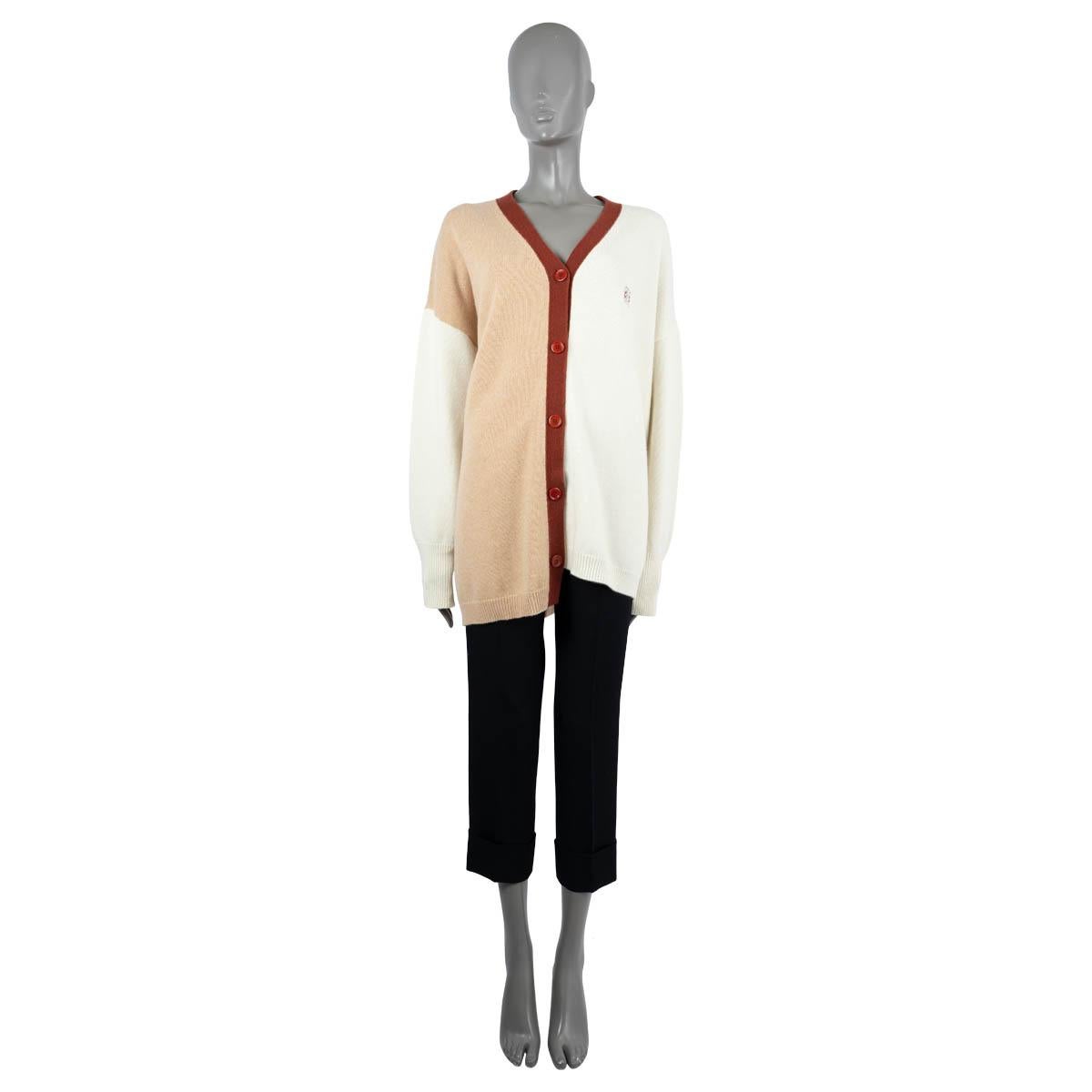 100% authentic Loewe colorblock cardigan in ivory and beige wool (100%). Features a V-neck, an asymmetric hem line, ribbed cuffs and hem, a contrast burgundy trim and Anagram embroidery. Relaxed fit with drop shoulders. Closes with buttons on the