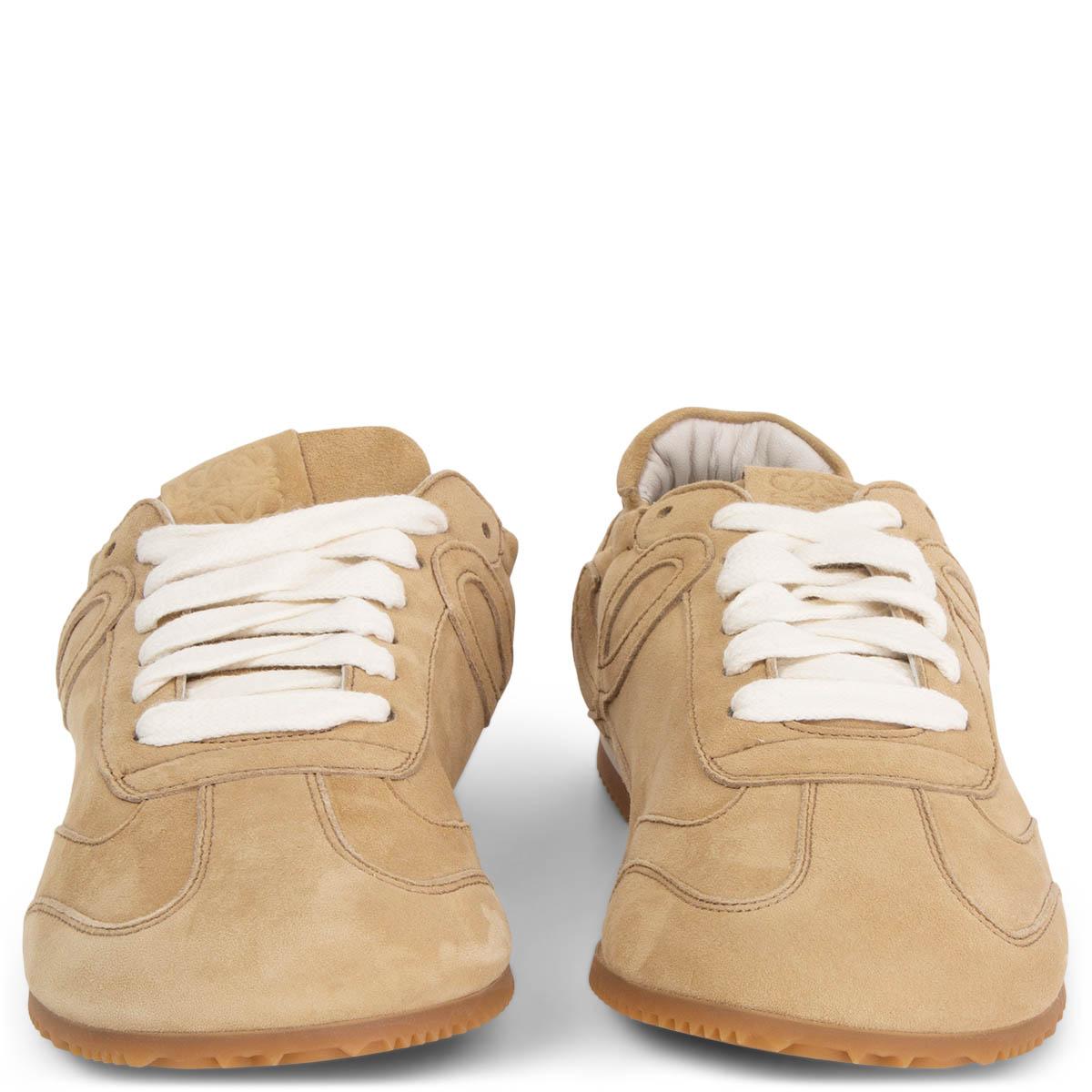 100% authentic LOEWE low-top Ballet Runner sneakers in beige suede and white laces. The design is set on a slim rubber sole. Brand new. 

Measurements
Imprinted Size	36
Shoe Size	36
Inside Sole	23cm (9in)
Width	7cm (2.7in)

All our listings include
