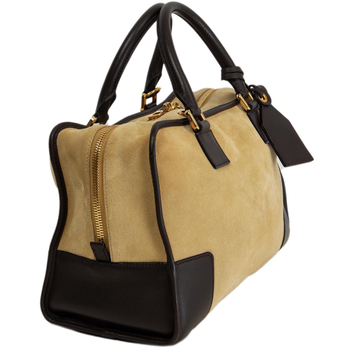 100% authentic Loewe Amazona 36 shoulder bag in beige suede and espresso brown calfskin trimming and handles featuring gold-tone hardware. Open with a zipper on top and is lined in beige and dark brown calfskin with one zip pocket against the back.