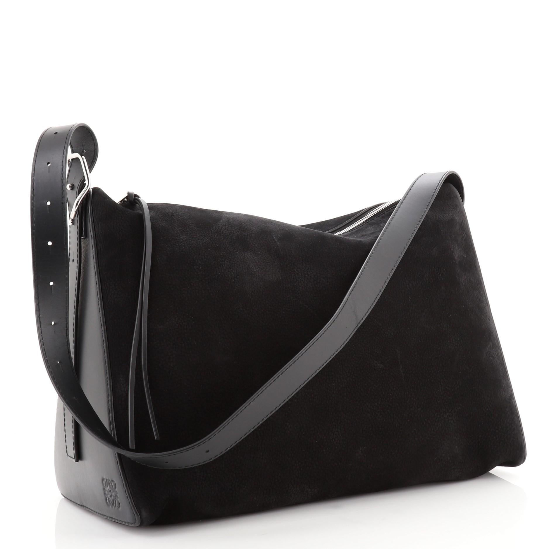 Loewe Berlingo Bag Nubuck with Calfskin Large
Black

Condition Details: Moderate wear and scuffs on exterior and strap, small indentations on sides. Minor wear in interior, scratches on hardware.

51941MSC

Height 