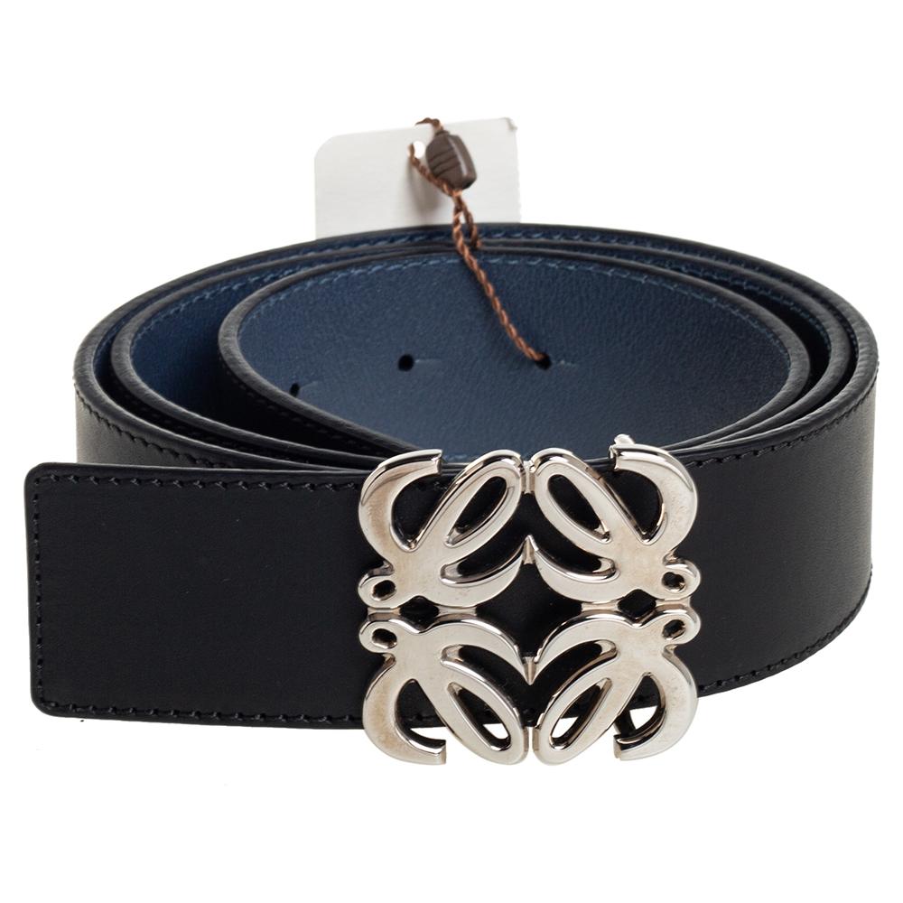 Introducing a fresh and contemporary style, this amazing belt from Loewe is for women who love to flaunt their bold fashion sense. Crafted with black & blue leather, this reversible belt is complete with a silver-tone signature buckle to the front