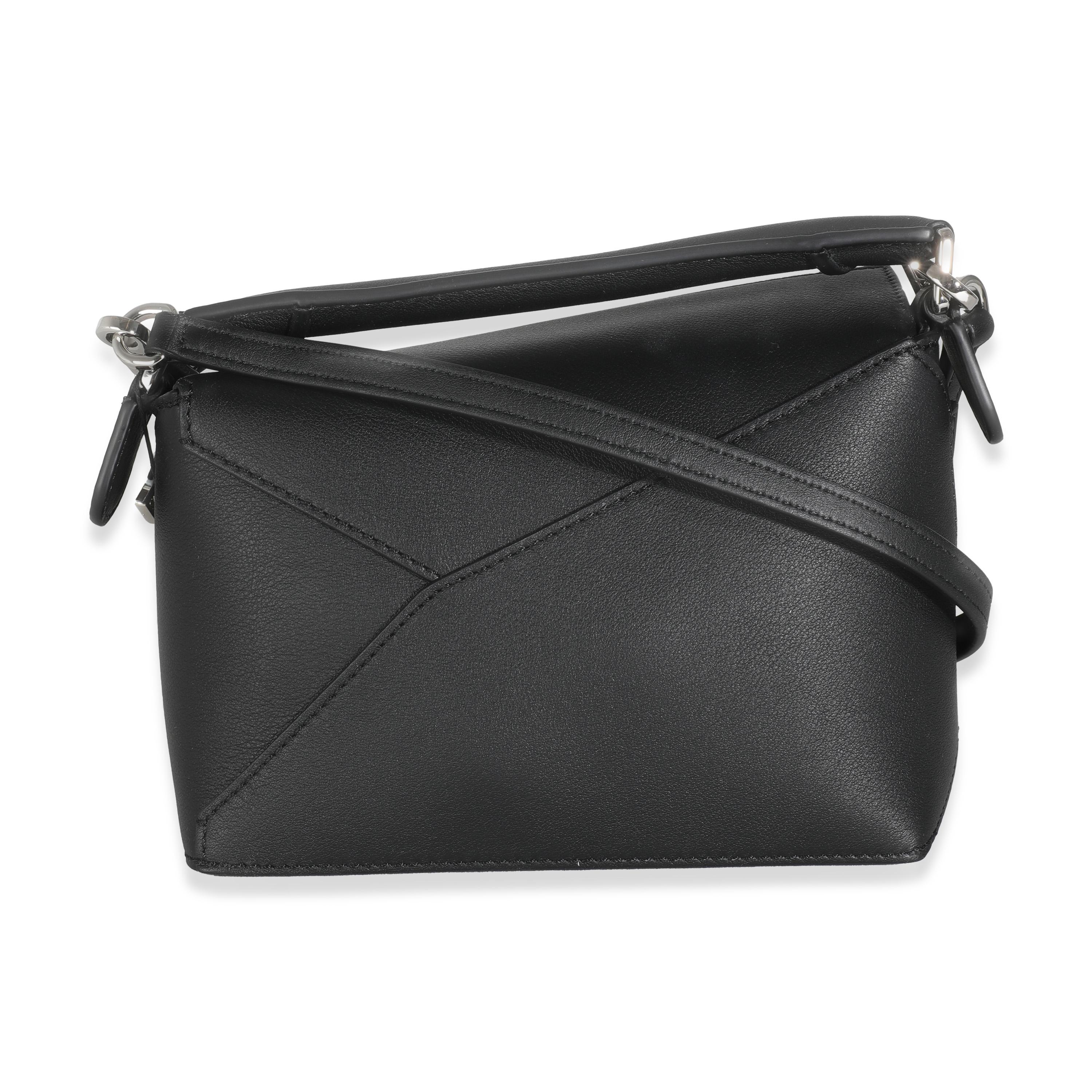 Listing Title: Loewe Black Calfskin Mini Puzzle Edge Bag
SKU: 145799
MSRP: 2650.00 USD
Condition: Pre-owned 
Handbag Condition: Pristine
Condition Comments: Item has no indication of wear.  Final sale.
Brand: Loewe
Model: Mini Puzzle Edge Bag
Origin