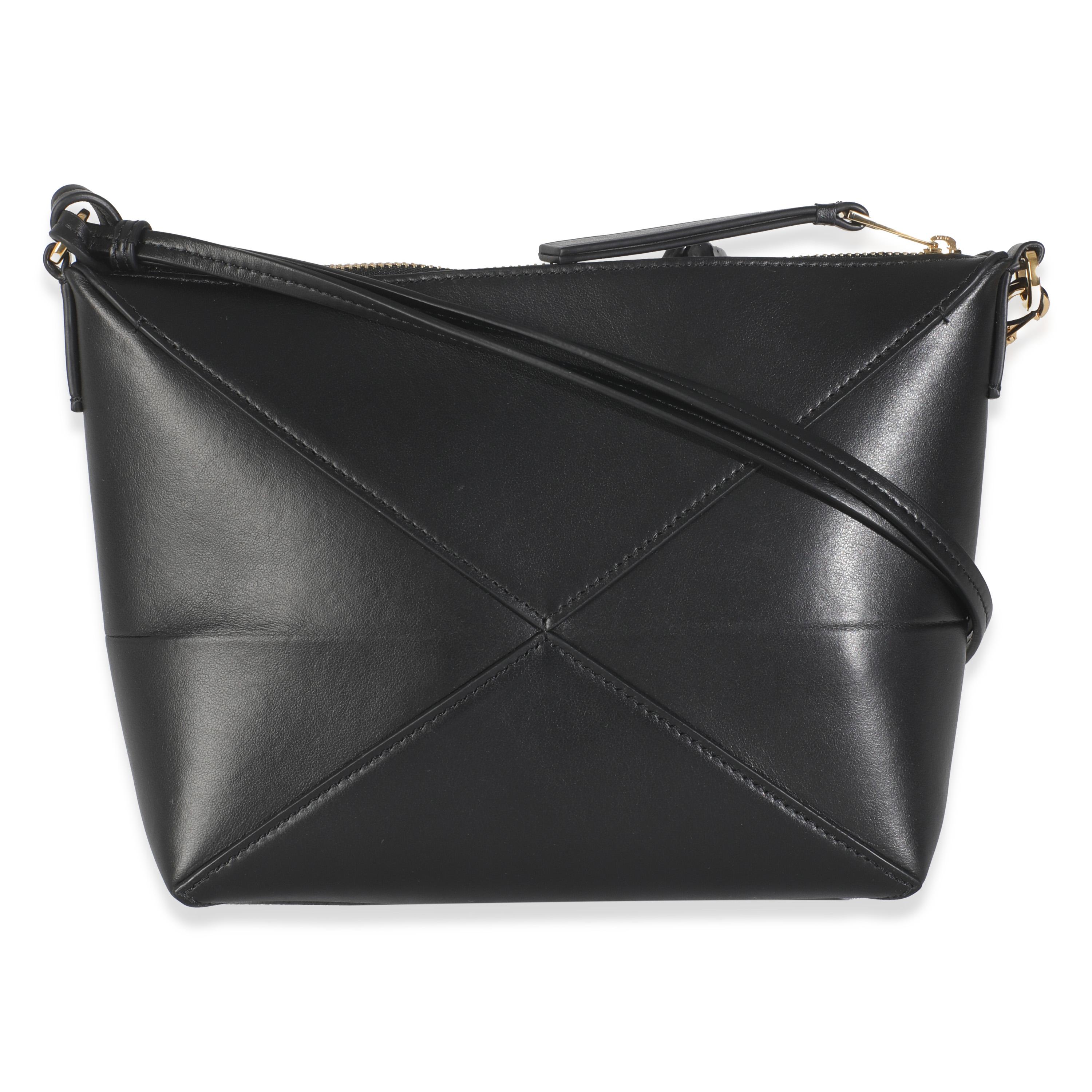 Listing Title: Loewe Black Calfskin Puzzle Fold Pouch
SKU: 145801
MSRP: 1750.00 USD
Condition: Pre-owned 
Handbag Condition: Pristine
Condition Comments: Item has no indication of wear.  Final sale.
Brand: Loewe
Model: Puzzle Fold Pouch
Origin