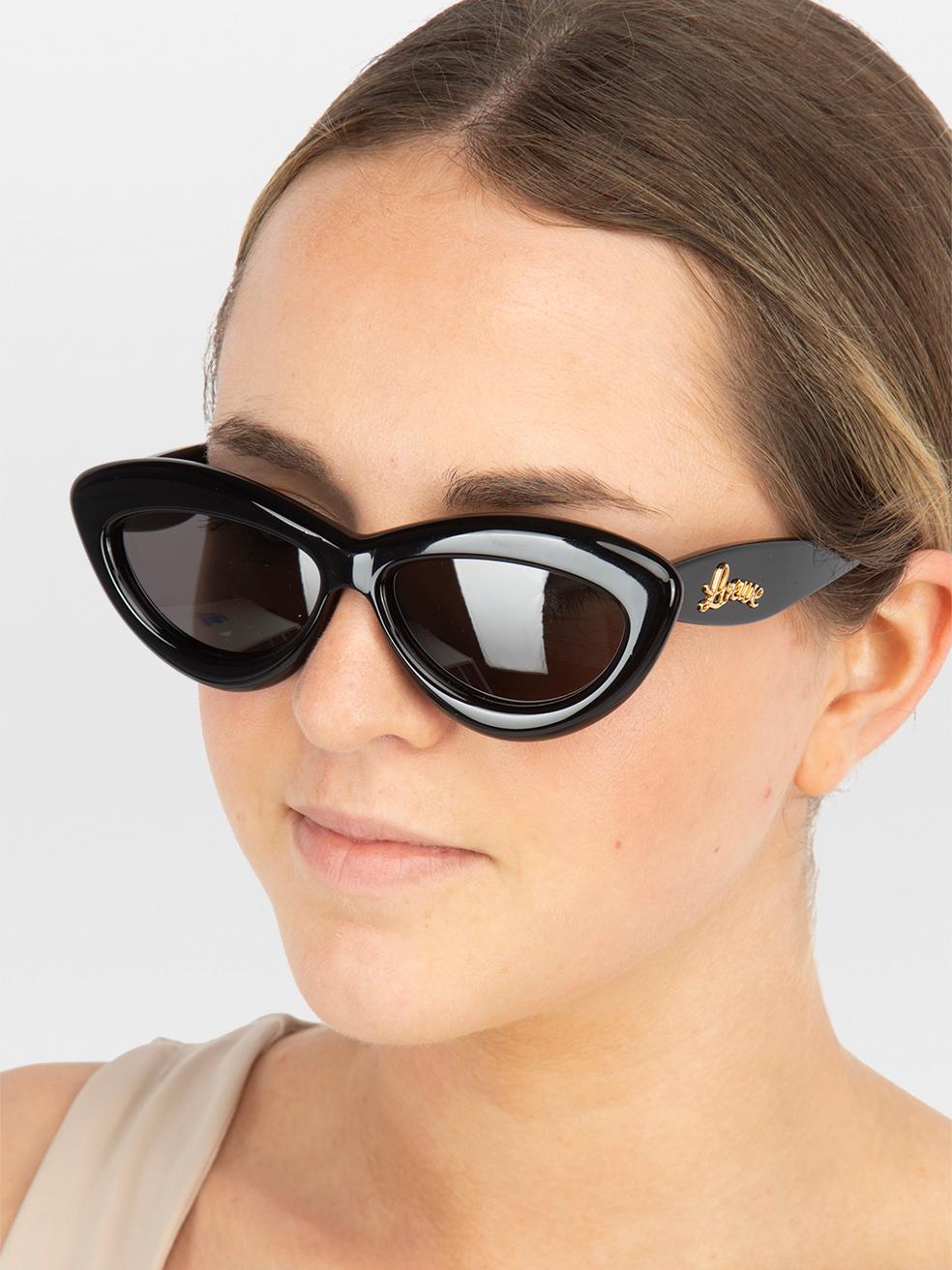 CONDITION is New with tags. No visible wear to sunglasses is evident on this new Loewe designer resale item. This item comes with original packaging.
 

 
 Details
 
 
 Model: LW40096I
 
 Black
 
 Acetate
 
 Cat eye sunglasses
 
 Grey tinted lenses
