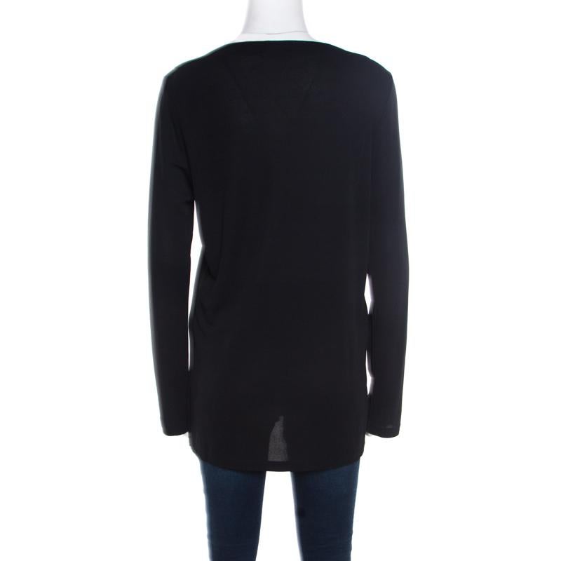 This tunic top from Loewe is simply amazing! The black creation is made of a viscose blend and features a simple structured silhouette. It flaunts a bateau neck and long sleeves. It is perfect for your casual outings!

Includes: The Luxury Closet