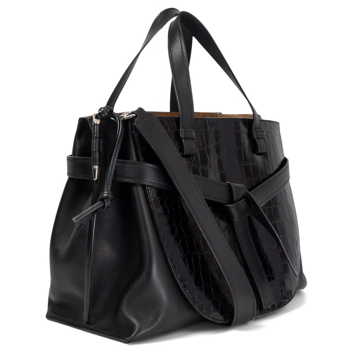 100% authentic Loewe Gate Top Handle Bag in black calfskin and crocodile. Design features leather knot detail and contrasting front panel. Interior is lined in beige suede and divided in three compartments with a zipped middle part and three patch