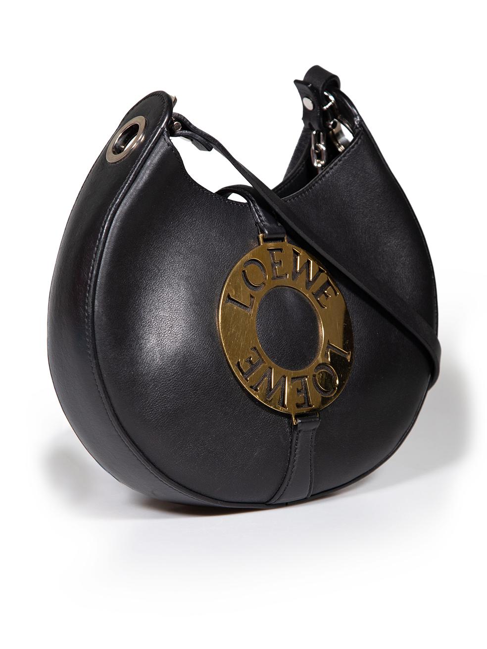 CONDITION is Good. Minor wear to bag is evident. Light wear to the shoulder strap with loose stitching and there are abrasions to the leather at the front, lining and back. Scratches are seen on the metal hardware on this used Loewe designer resale