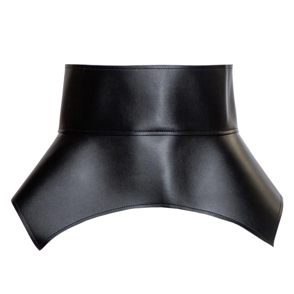 Made in Spain, Loewe's Obi waist belt is cut from leather in a peplum style. It has sharp cuts, tie detailing at the back, and an overall clean design. It can be styled with dresses, jumpsuits, or chic suits.

Includes: Original Dustbag, Info
