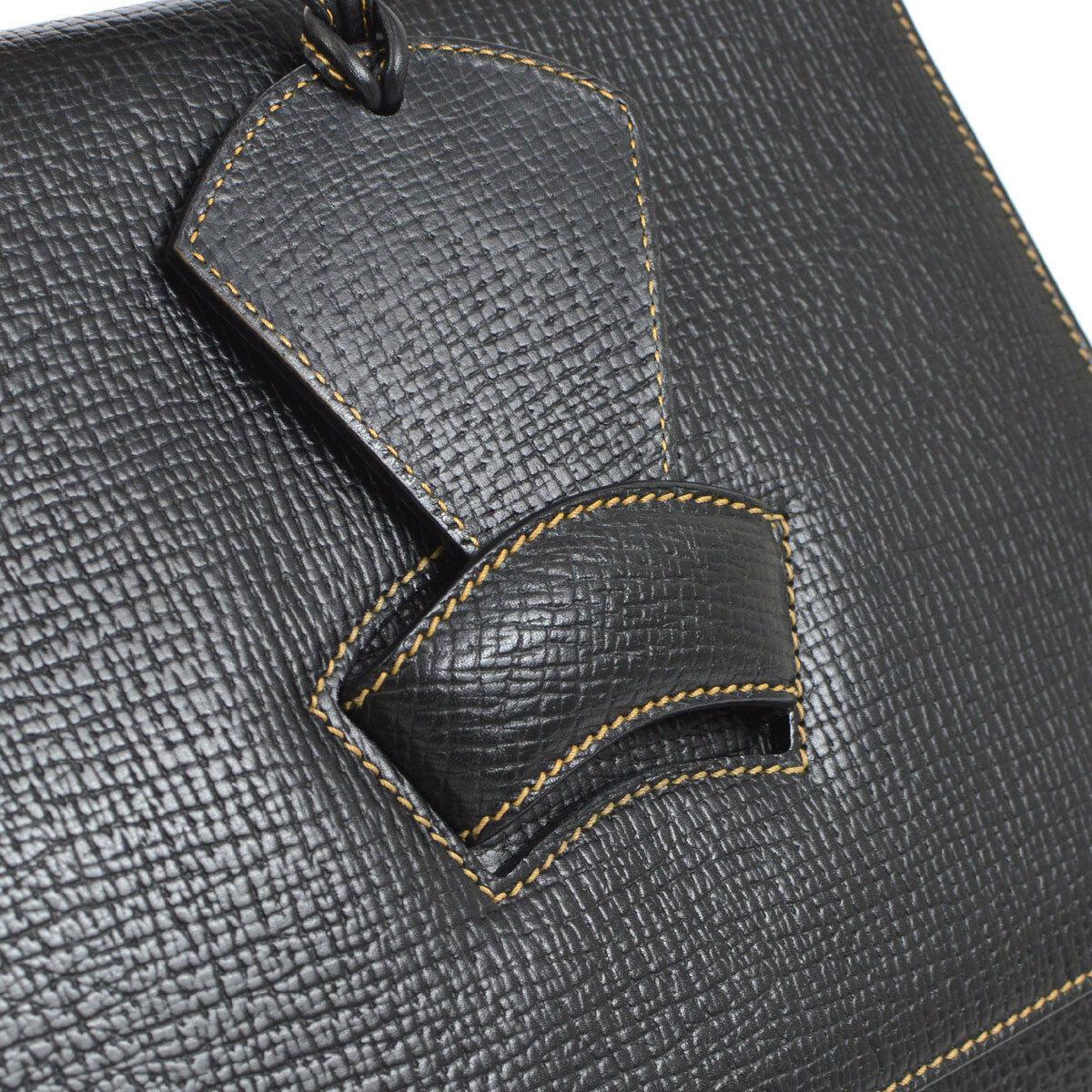 Loewe Black Leather Slip Buckle Kelly Style Top Handle Satchel Shoulder Bag

Leather
Suede lining
Slip buckle closure 
Made in Spain
Handle drop 3.5