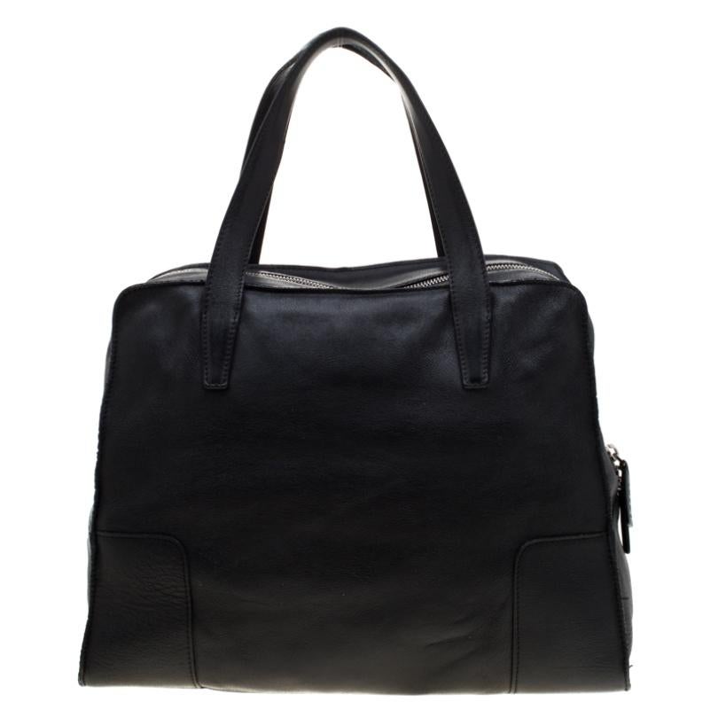 This Loewe creation is splendid for your everyday use, and even for special events. Its black leather exterior is durable and the suede interior is spacious. A closet staple, this black bag will complement you with utmost ease.

Includes: The Luxury