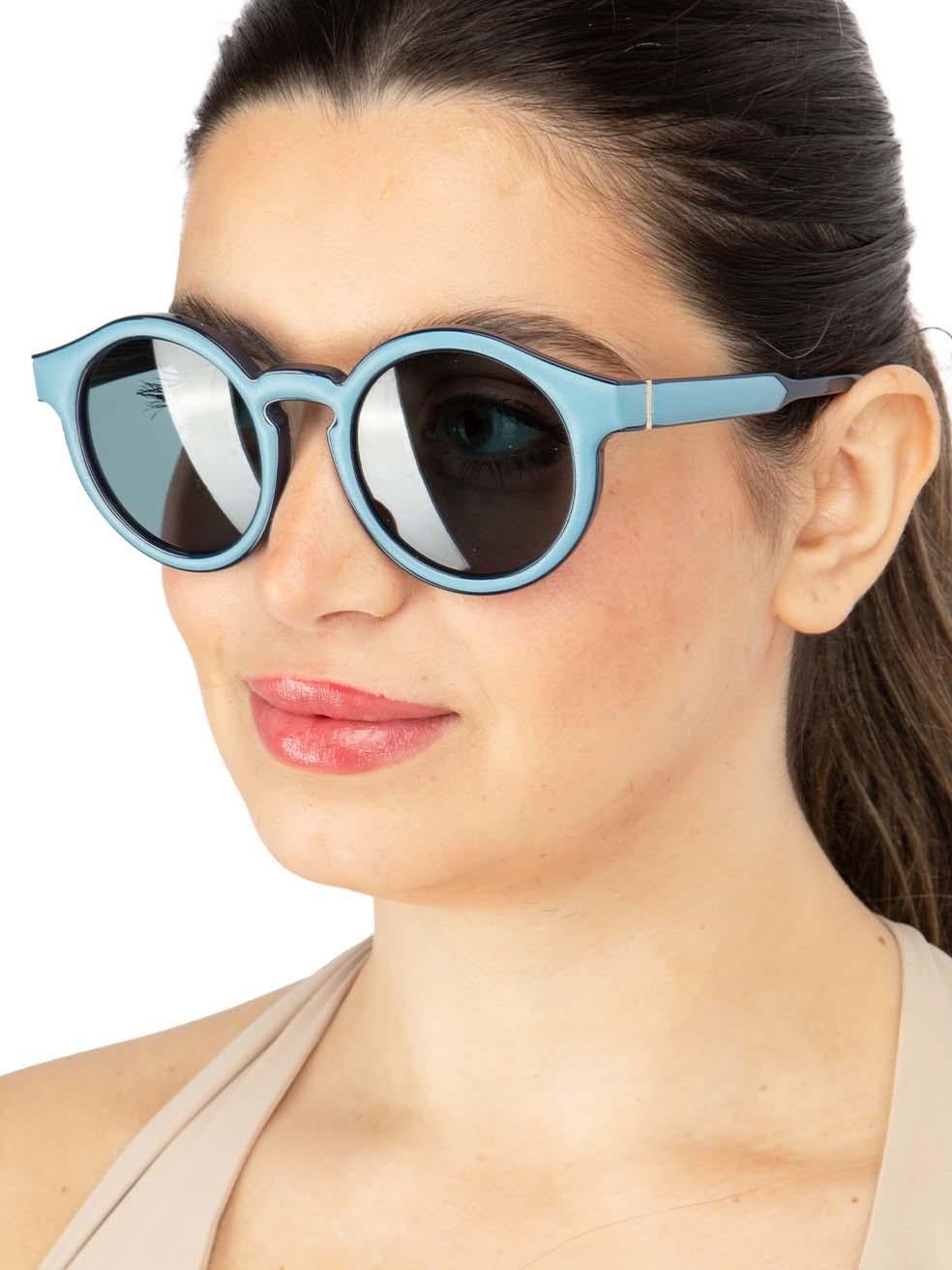 CONDITION is New with tags on this brand new Loewedesigner item. This item comes with original packaging.
 
 
 
 Details
 
 
 Model: LW40002I 5292V
 
 Blue
 
 Acetate and Leather
 
 Round Eye Sunglasses
 
 Tinted Blue Lens
 
 Blue Leather Trim
 

