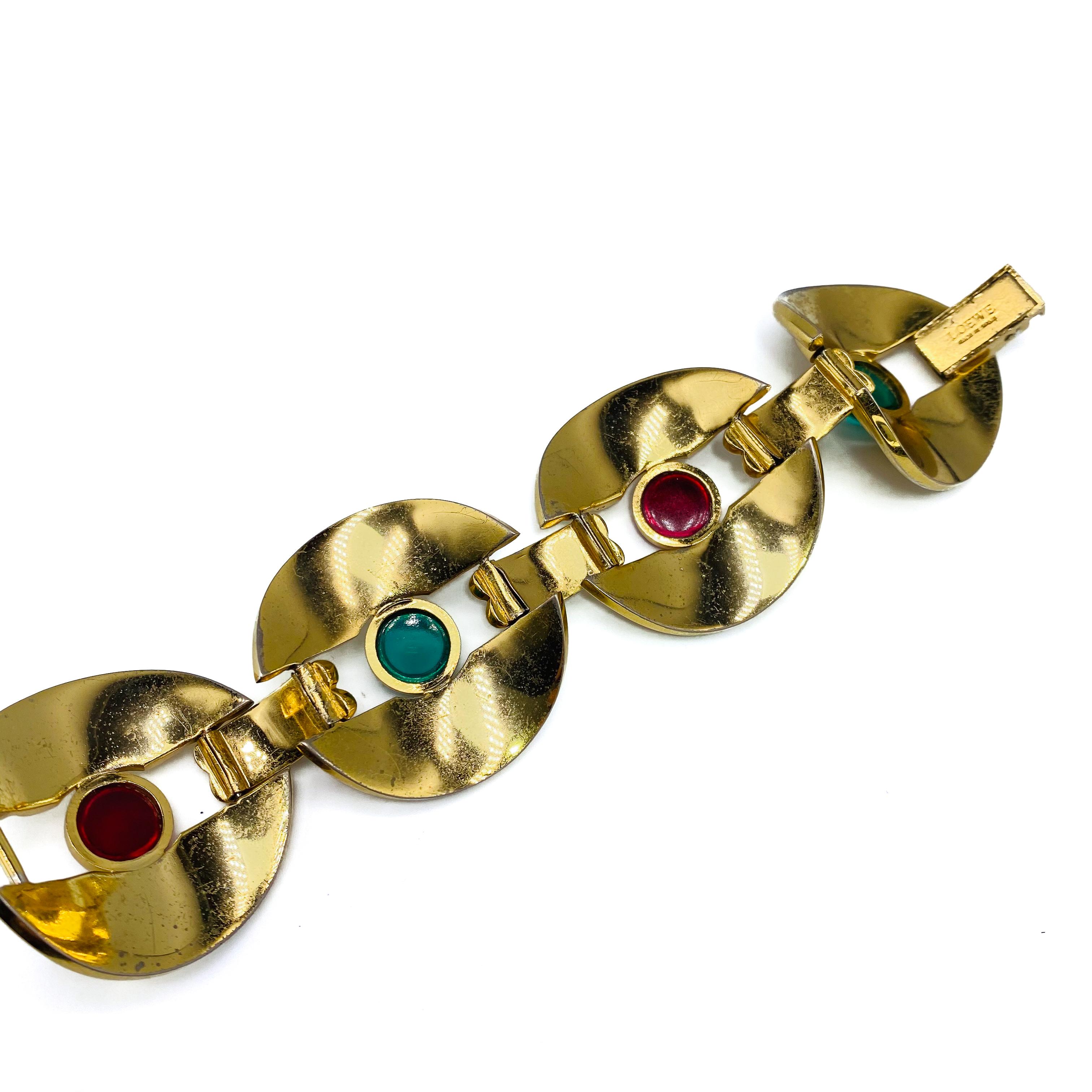 Loewe Vintage Cuff Bracelet 

Incredible cuff bracelet with 1970s mod styling from Loewe. Made in Spain in the early 2000s, this amazing bracelet is crafted from gold plated metal and set with Cabouchon stones

Size & Fit
-Length - 7.5 inches