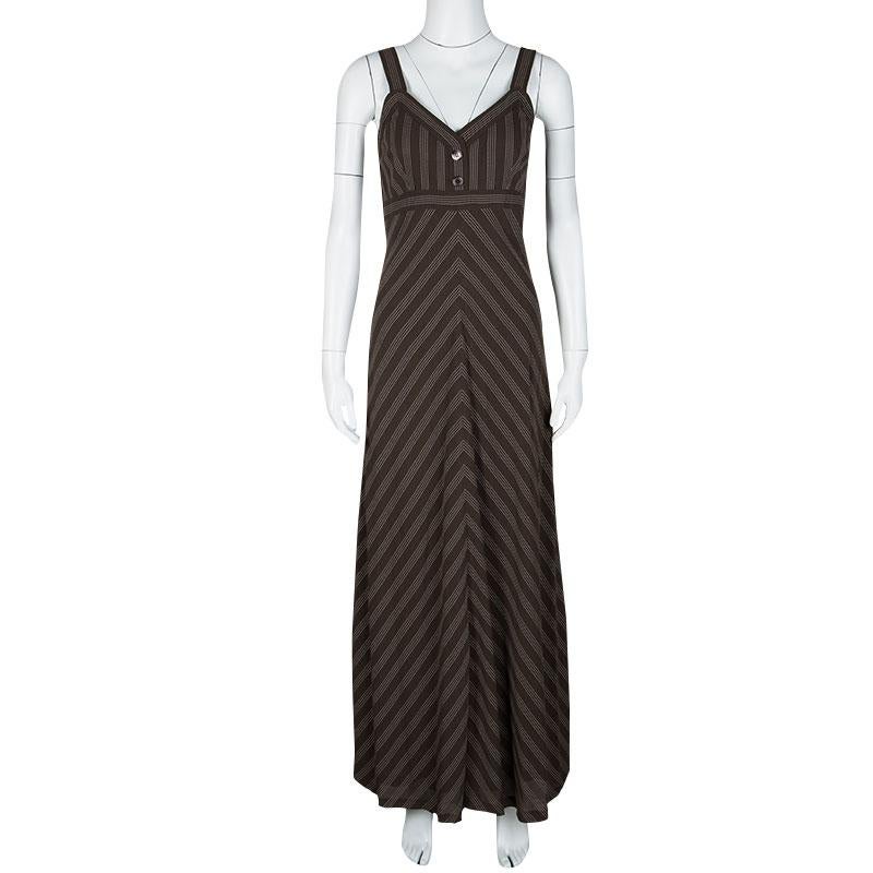 Summer season calls for easygoing and breathable silhouettes like that of this Loewe maxi dress. It features a chevron striped pattern and detailed with buttons on the front. Dress it up for a summer party or go comfy and casual for vacations by