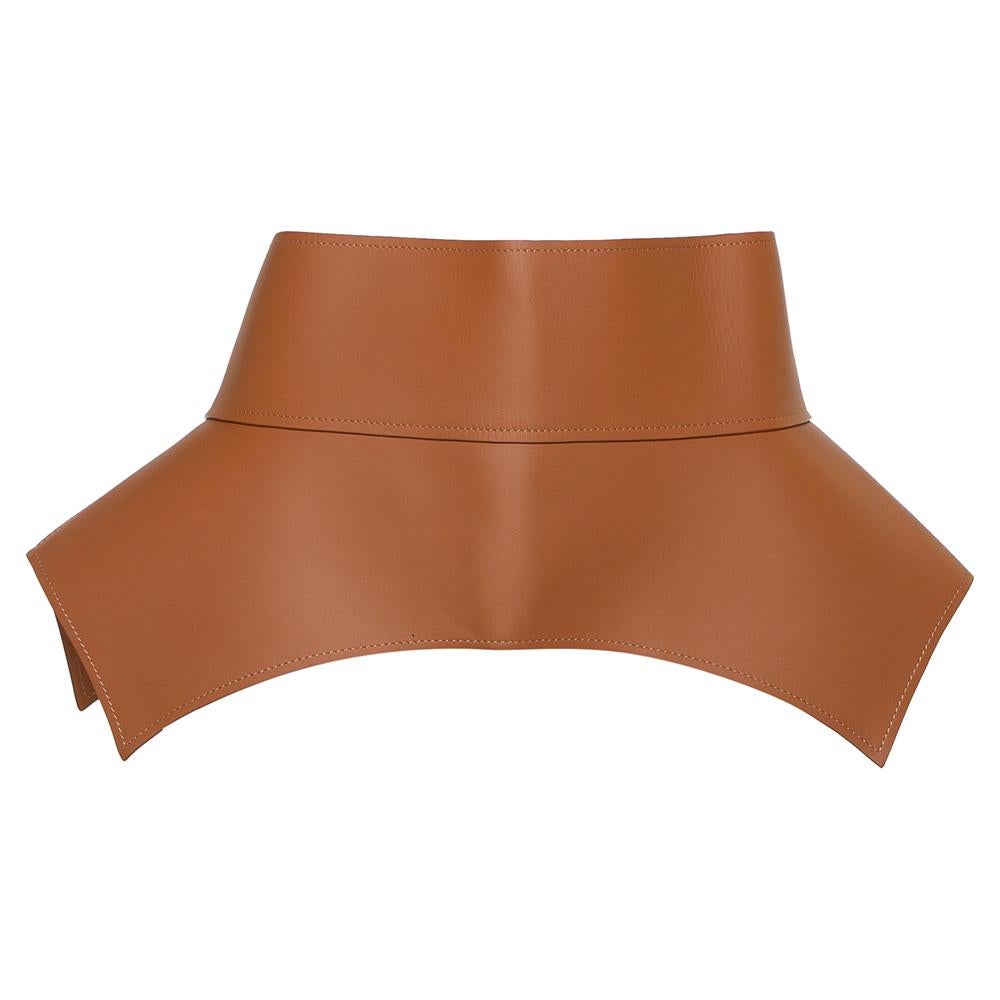 Made in Spain, Loewe's Obi waist belt is cut from leather in a peplum style. It has sharp cuts, tie detailing at the back, and an overall design. It can be styled with dresses, jumpsuits, or chic suits.

Includes: Original Dustbag
