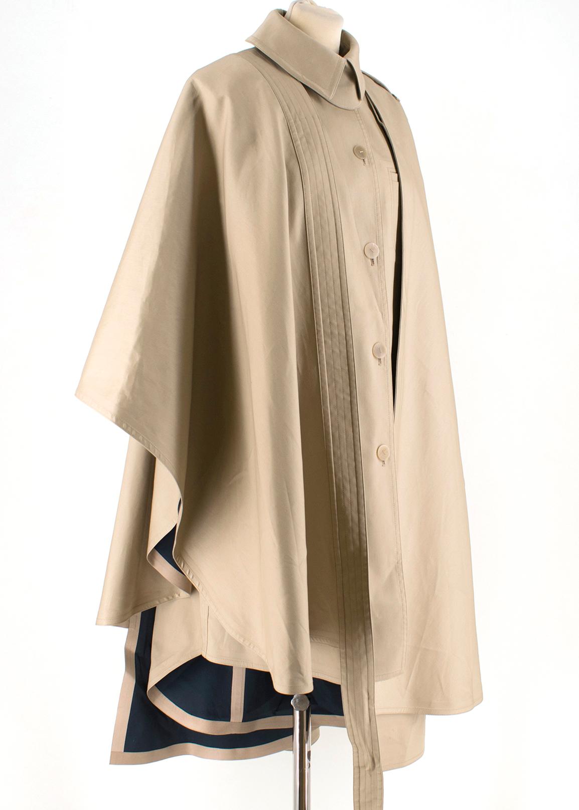 Loewe Convertible asymmetric cotton cape

- Cape
- Cotton-gabardine
- Detachable overlay
- Front welt pocket
- Breast pocket
- Button fastenings through front
- Fully lined
- Asymmetric hem
- Non-stretchy fabric
- Mid-weight fabric

Cotton 100%

Dry