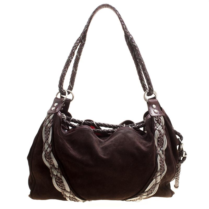 The lovely braided embellishments sitting atop the dark brown suede base makes this pretty hobo from Loewe a loved piece that must be added to your luxe closet. It has a relaxed structure featuring a spacious fabric-lined interior where you can