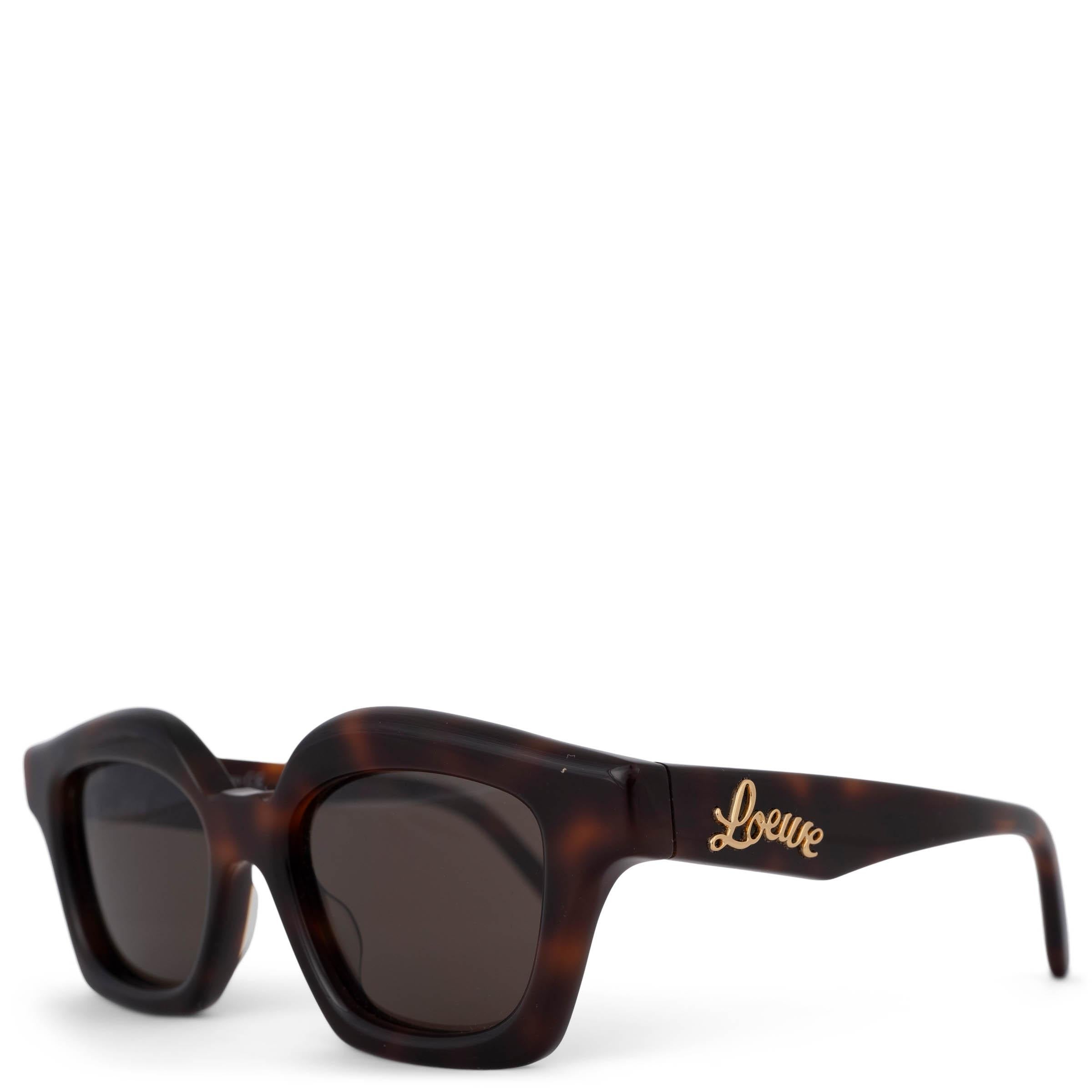 These 100% authentic Loewe Small Browlined sunglasses are crafted from shiny dark havana tortoise acetate and feature classic brown lenses. The design is finished with a gold-tone Loewe logo script on the temples, adding a refined and luxurious