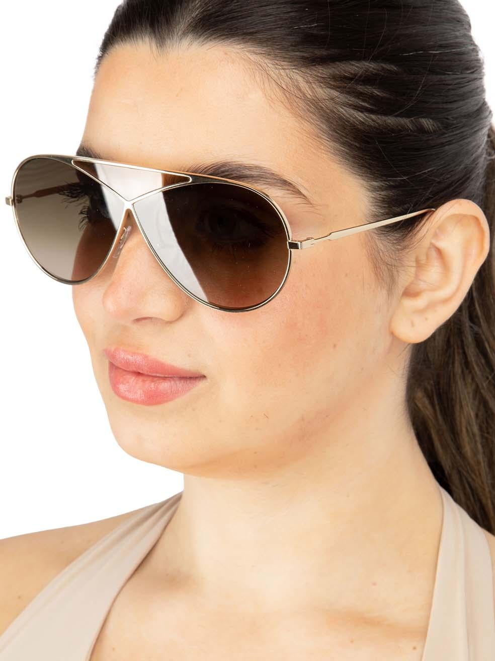 CONDITION is New with tags on this brand new Loewe designer item. This item comes with original packaging.
 
 
 
 Details
 
 
 Model: LW40010U 33K
 
 Gold
 
 Metal
 
 Aviator Eye Sunglasses
 
 Gradient Brown Lens
 
 Branding at the arms
 
 Full-Rim
