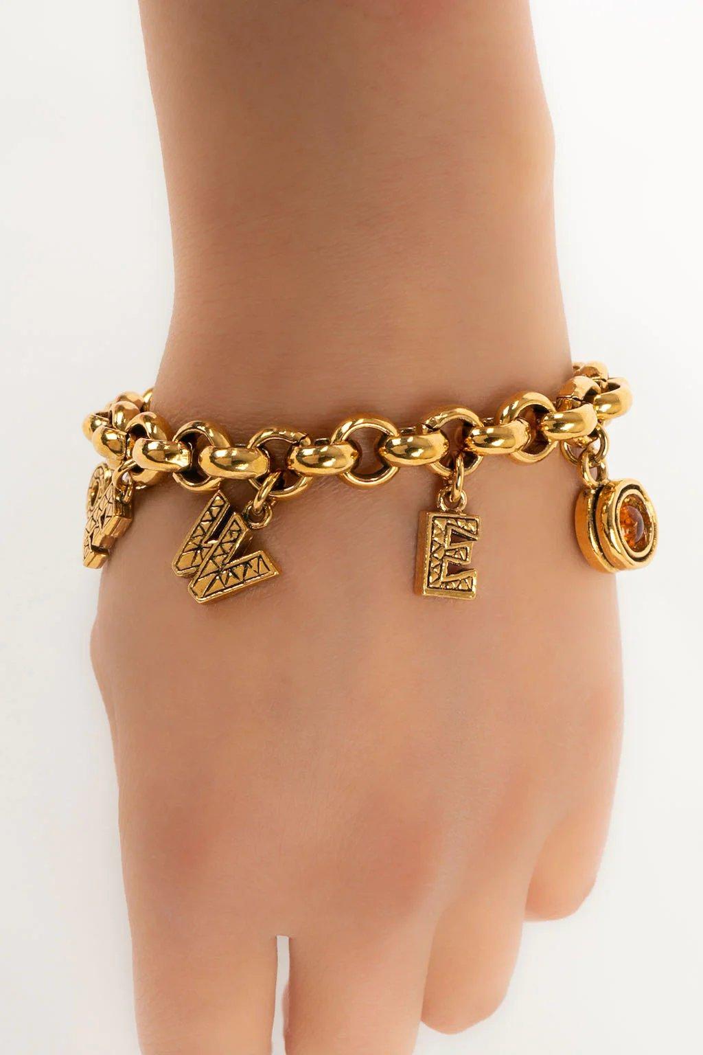 Loewe Golden Metal Bracelet with Charms In Excellent Condition For Sale In SAINT-OUEN-SUR-SEINE, FR