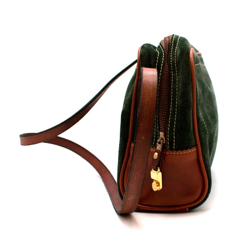 Loewe Green Suede Vintage Shoulder Bag

- Made of soft velvet like suede 
- Gorgeous green hue 
- Brown leather details 
- Iconic logo to the side 
- Contrasting top stitching details 
- Leather shoulder strap 
- Gold tone hardware 
- Zip fastening