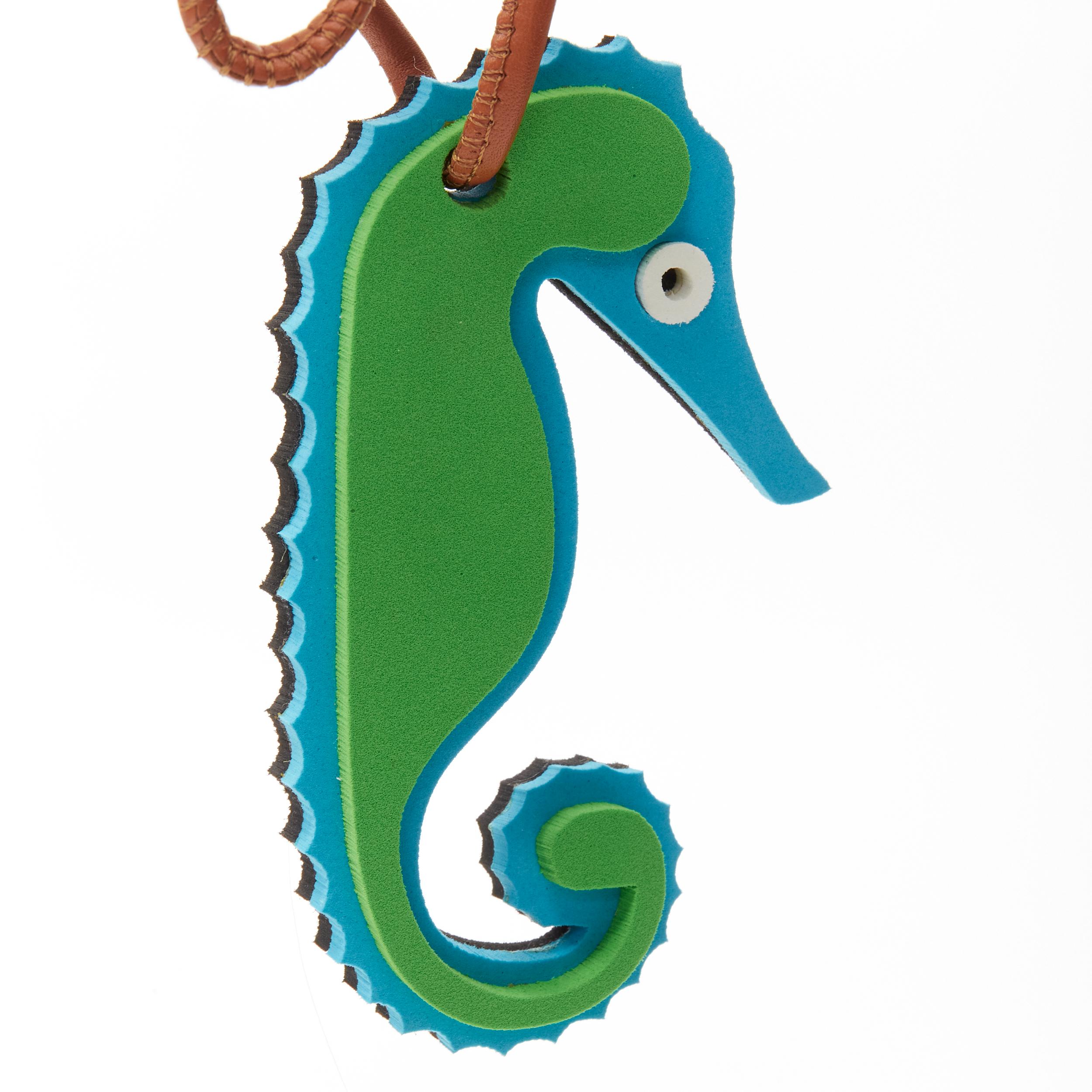 LOEWE grene blue seahorse foam brown leather cord bag charm 
Reference: ANWU/A00106 
Brand: Loewe 
Designer: JW Anderson 
Material: Foam 
Color: Green 
Pattern: Solid 
Closure: Tie 
Extra Detail: Styrofoam charm with leather cord self tie strap.