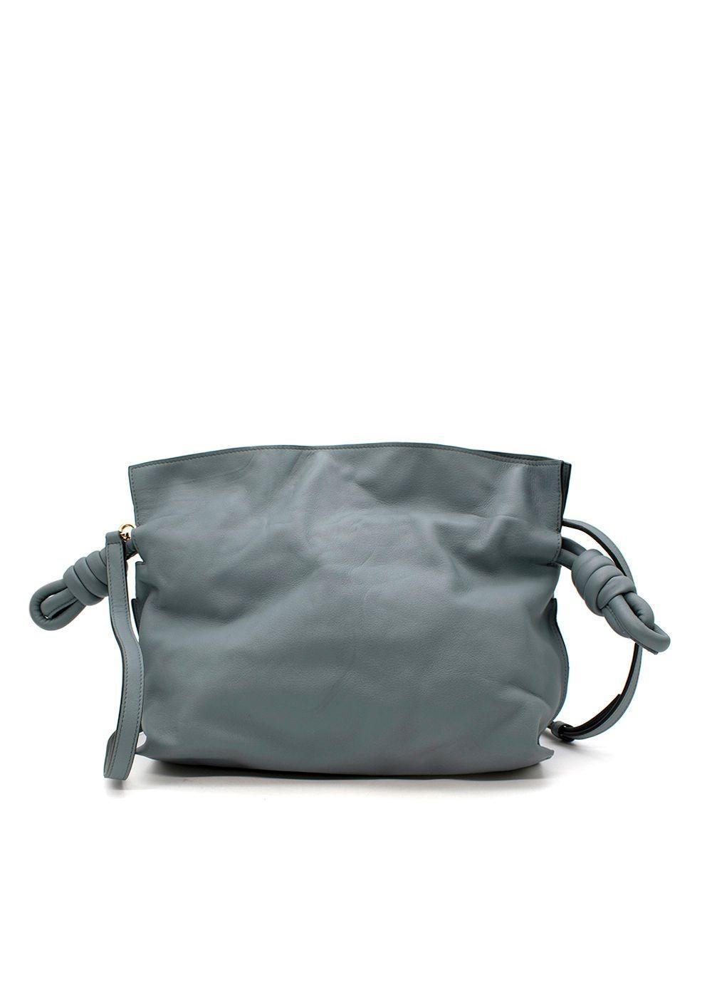 Loewe Grey-Blue Leather Flamenco Knot Bag

- Muted grey-blue hue
- Rectangular soft body, with drawstring top
- Chunky leather drawcords with decoratively knotted ends
- Shoulder strap
- Magnet closure
- Lined in twill

Materials:
Sheep skin

9.5