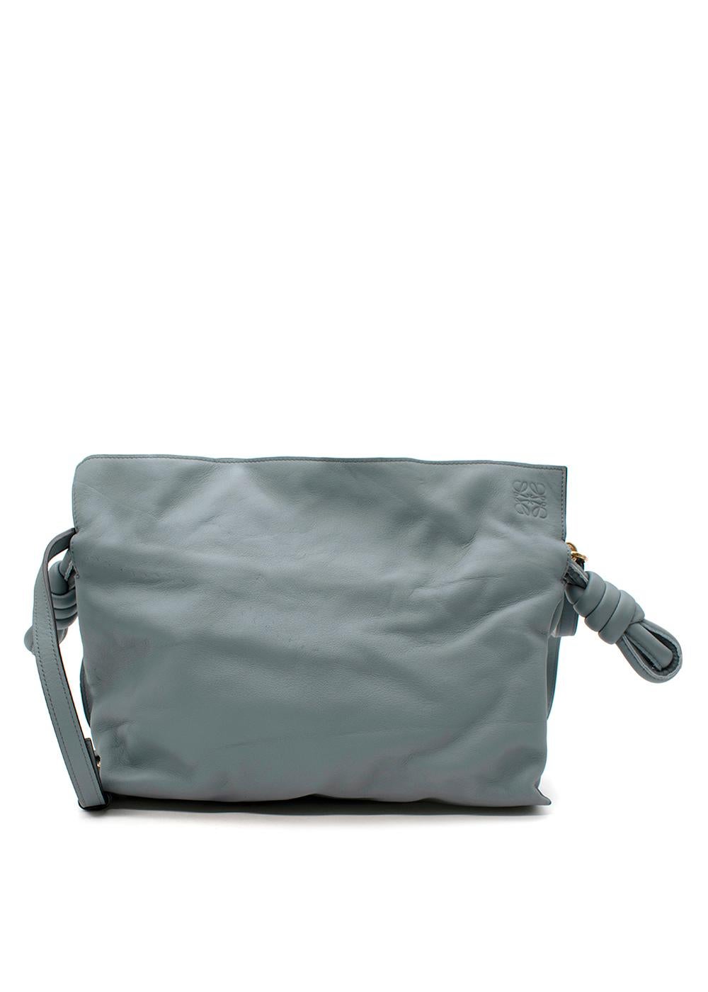 Loewe Grey-Blue Leather Flamenco Knot Bag

- Muted grey-blue hue
- Rectangular soft body, with drawstring top
- Chunky leather drawcords with decoratively knotted ends
- Shoulder strap
- Magnet closure
- Lined in twill

Materials:
Sheep skin

9.5