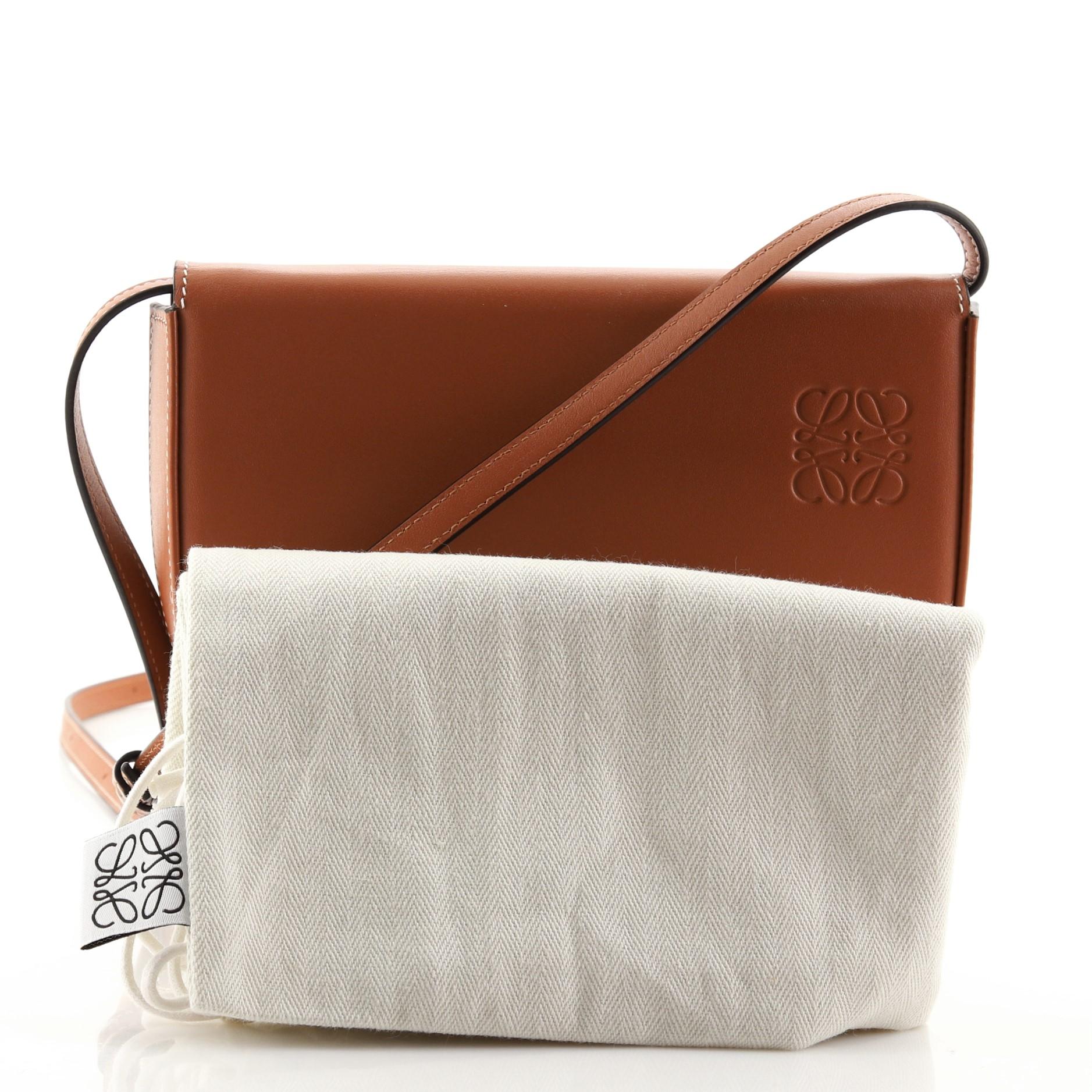 Condition: Great. Minor wear and scuffs on exterior and underneath flap, scratches on hardware.
Accessories: Dust Bag
Measurements:
Designer: Loewe
Model: Heel Crossbody Bag Leather Small
Exterior Material: Leather
Exterior Color: Brown
Interior