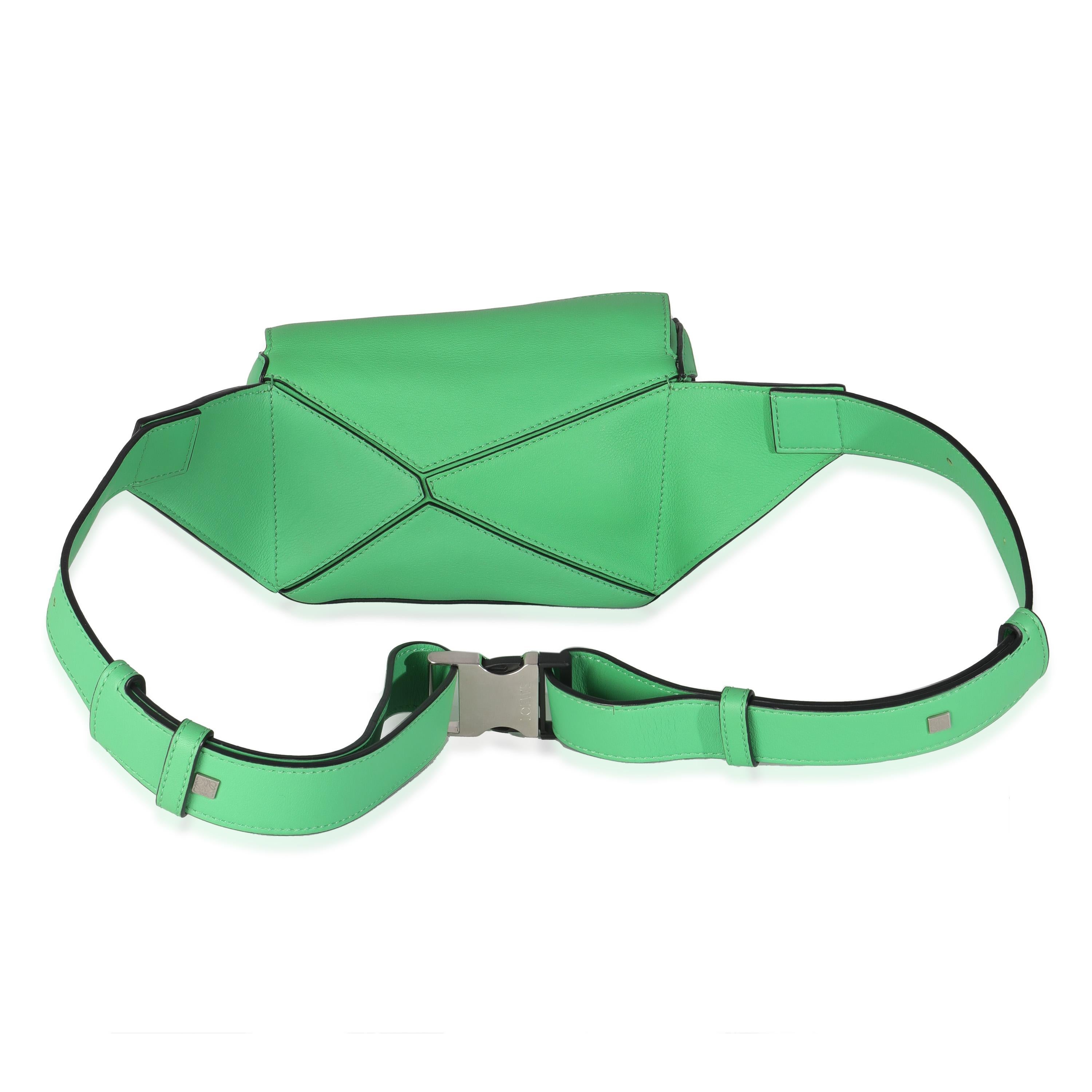 Listing Title: Loewe Jungle Green Calfskin Mini Puzzle Belt Bag
SKU: 144651
Condition: Pre-owned 
Handbag Condition: Excellent
Condition Comments: Item is in excellent condition and displays light signs of wear. Light wear along base.
Brand: