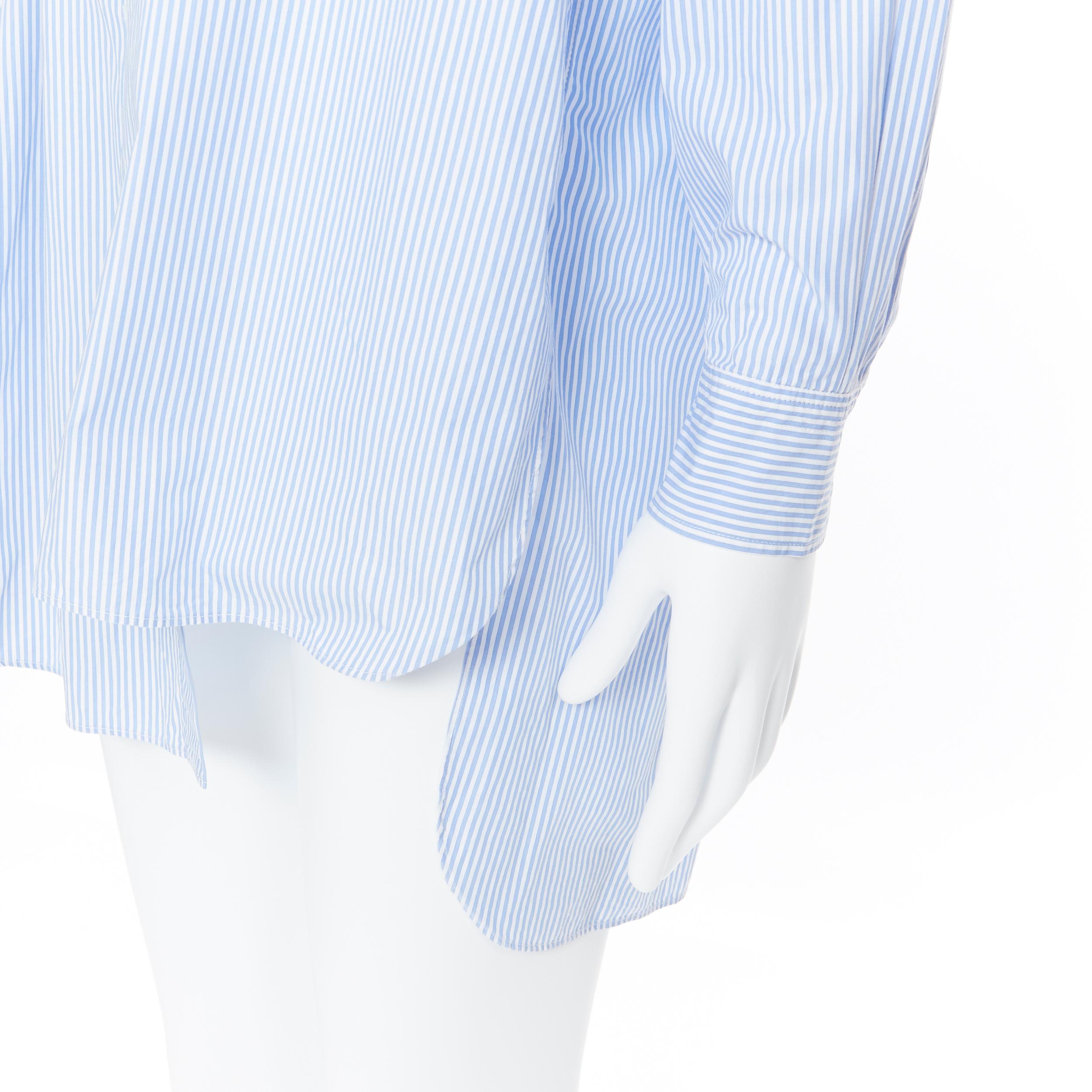 LOEWE JW ANDERSON 100% blue white striped cotton bib collar long line shirt S
Brand: Loewe
Designer: JW Anderson
Model Name / Style: Cotton shirt
Material: Cotton
Color: Blue
Pattern: Striped
Closure: Button
Extra Detail: Long sleeve.
Made in: