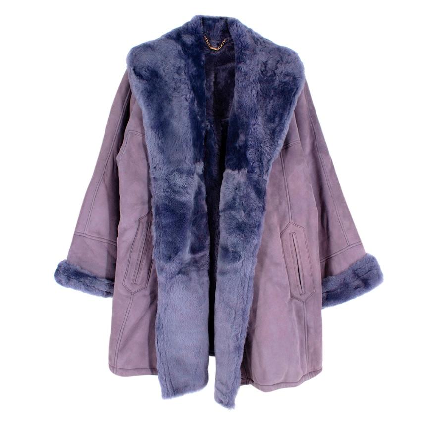 Loewe Lavender Shearling Vintage Oversize Coat

- Made of luxurious shearling 
- Soft suede texture 
- Gorgeous lavender hue 
- Oversized cut 
- Pockets to the front 
- Pleat details to the back 
- Elegant luxurious design 

Materials:
shearling