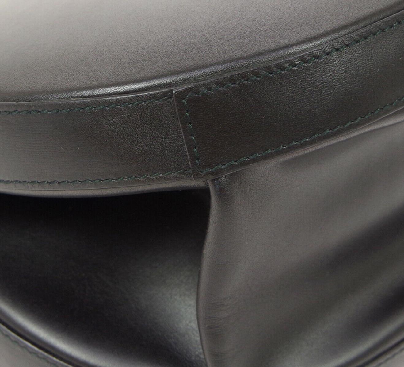 black leather top handle circle bag