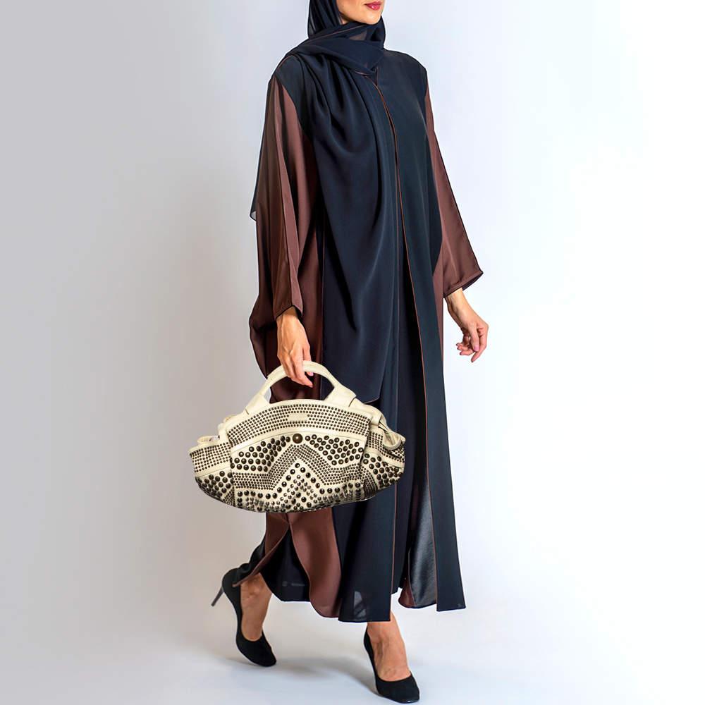 Simple yet luxurious in design, this hobo from Loewe definitely needs to be in your closet. The hobo is crafted from embellished leather and spells creative excellence. It features two handles and a spacious interior that will hold all your daily